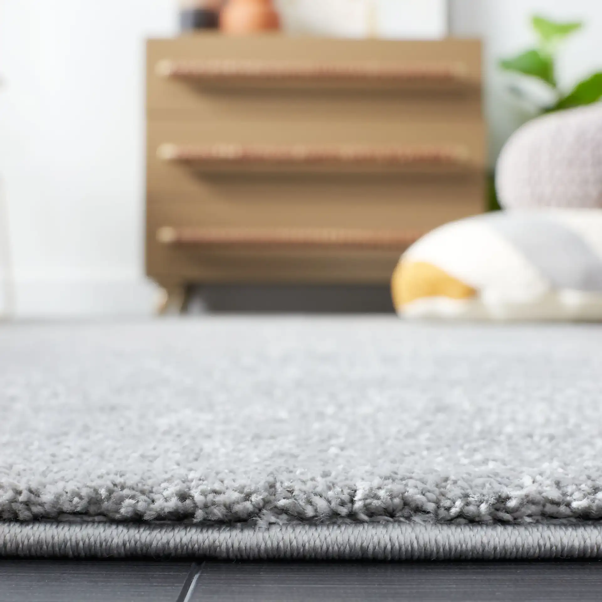 Non-Slip Solid Rug in Gray in a styled room