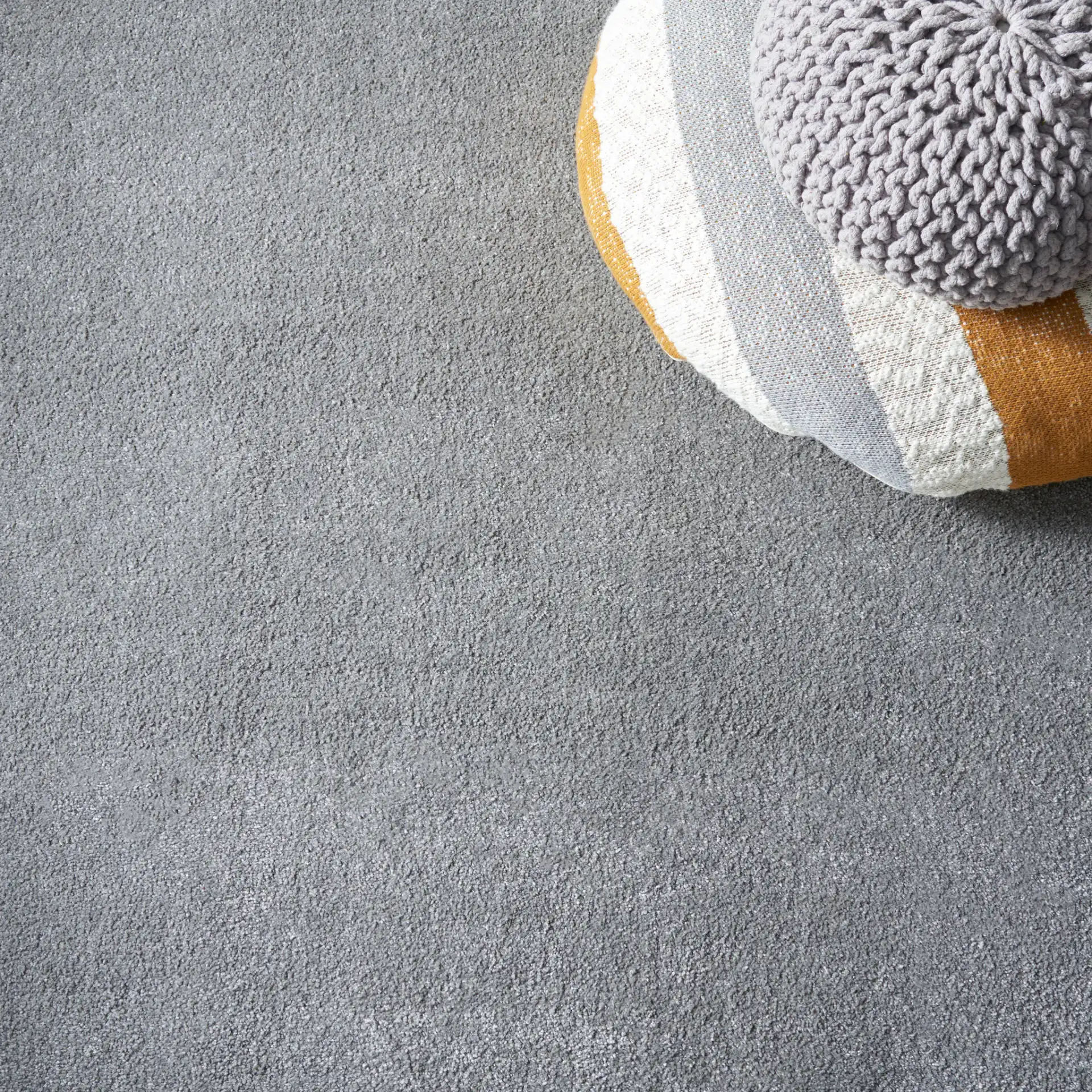 Non-Slip Solid Rug in Gray in a styled room
