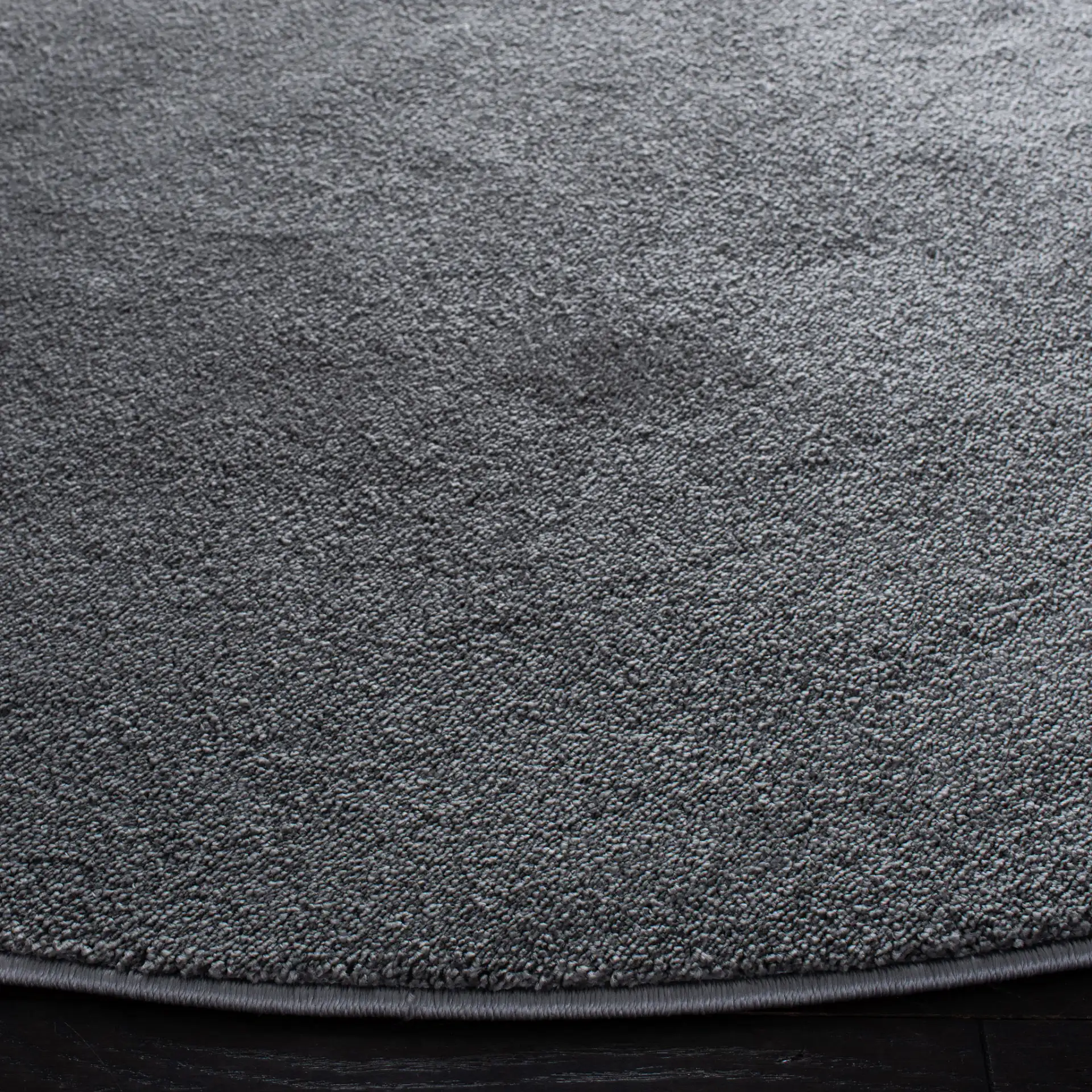 Non-Slip Solid Rug in Gray in a styled room