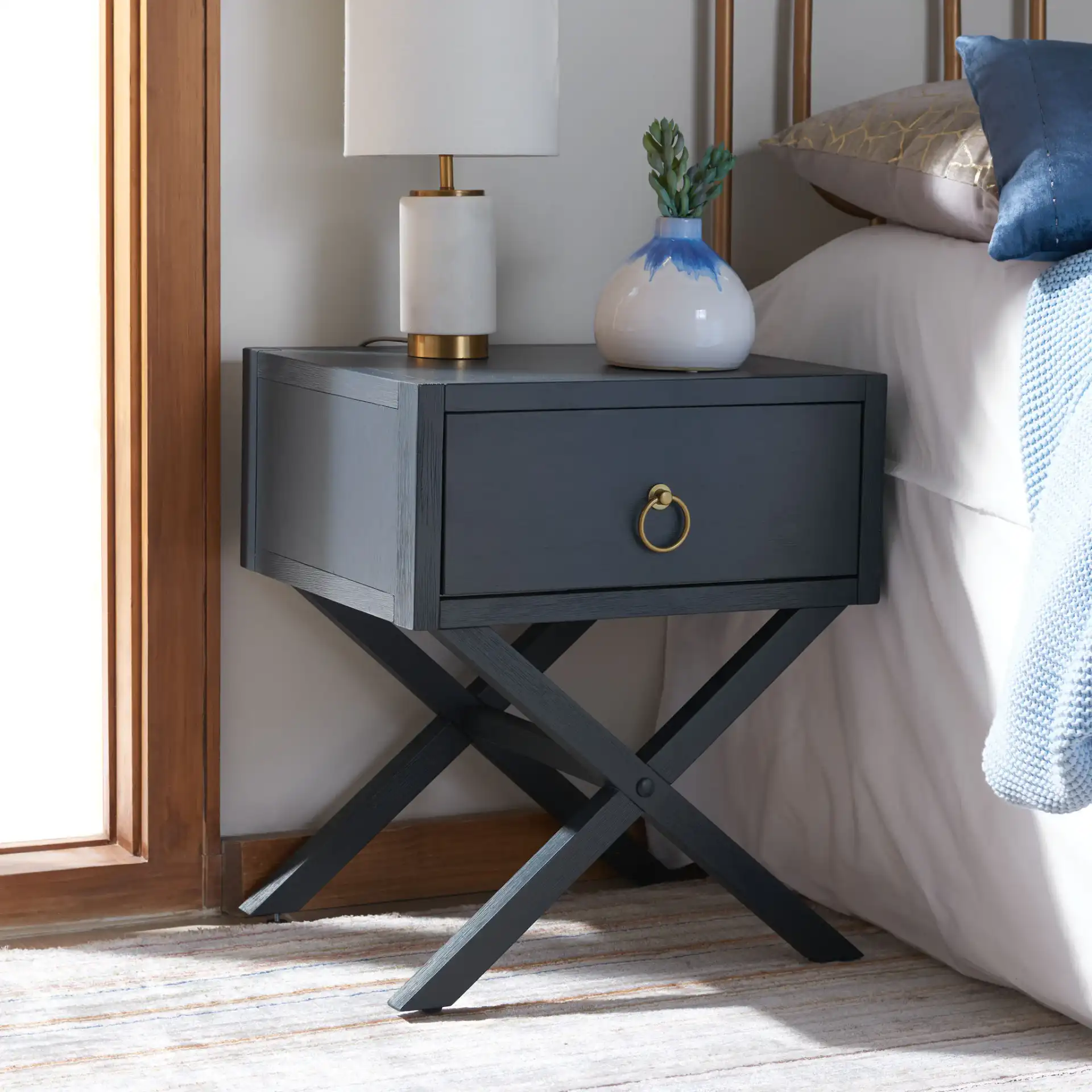 Sadie 1 Drawer Nightstand in Navy Blue in a styled room