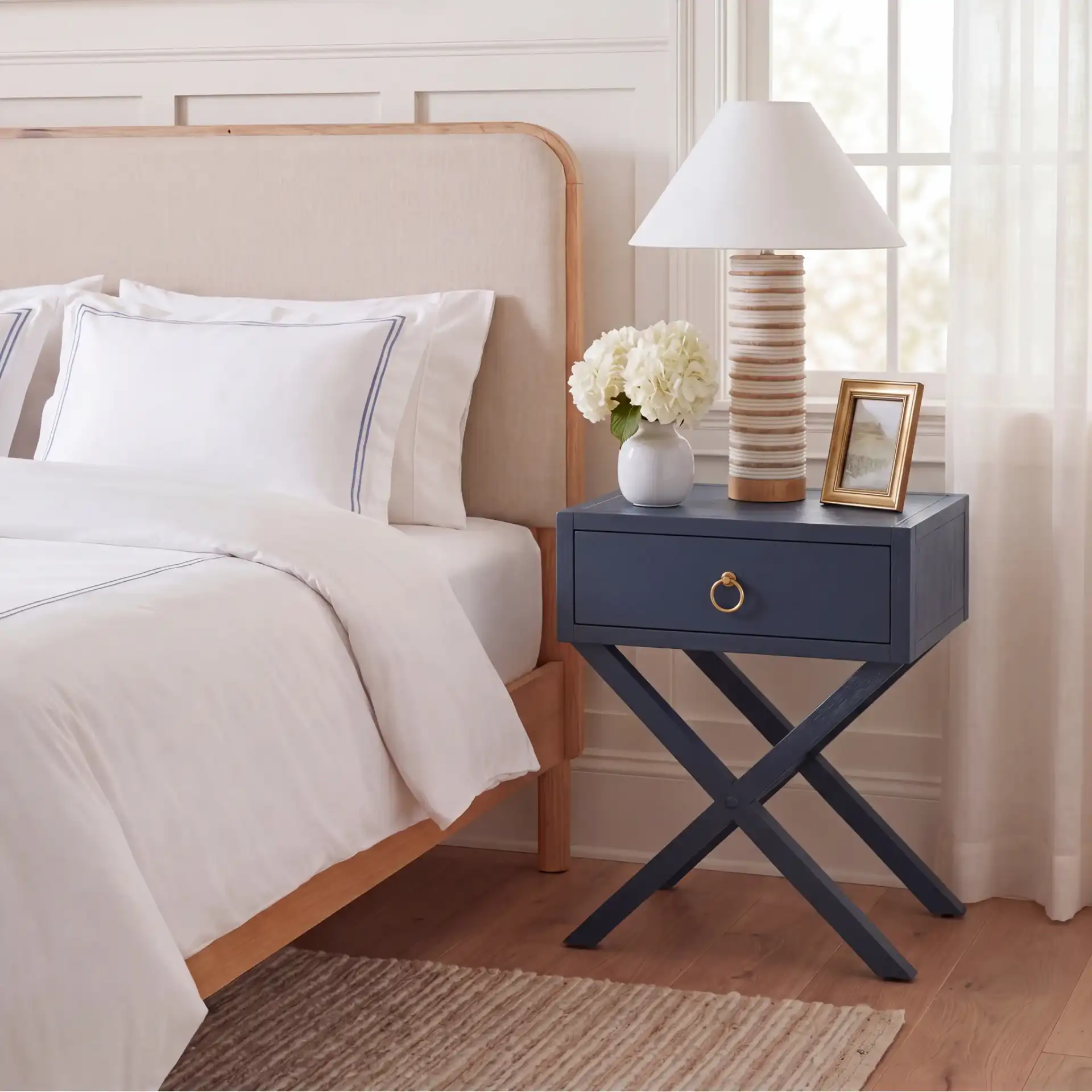 Sadie 1 Drawer Nightstand in Navy Blue in a styled room