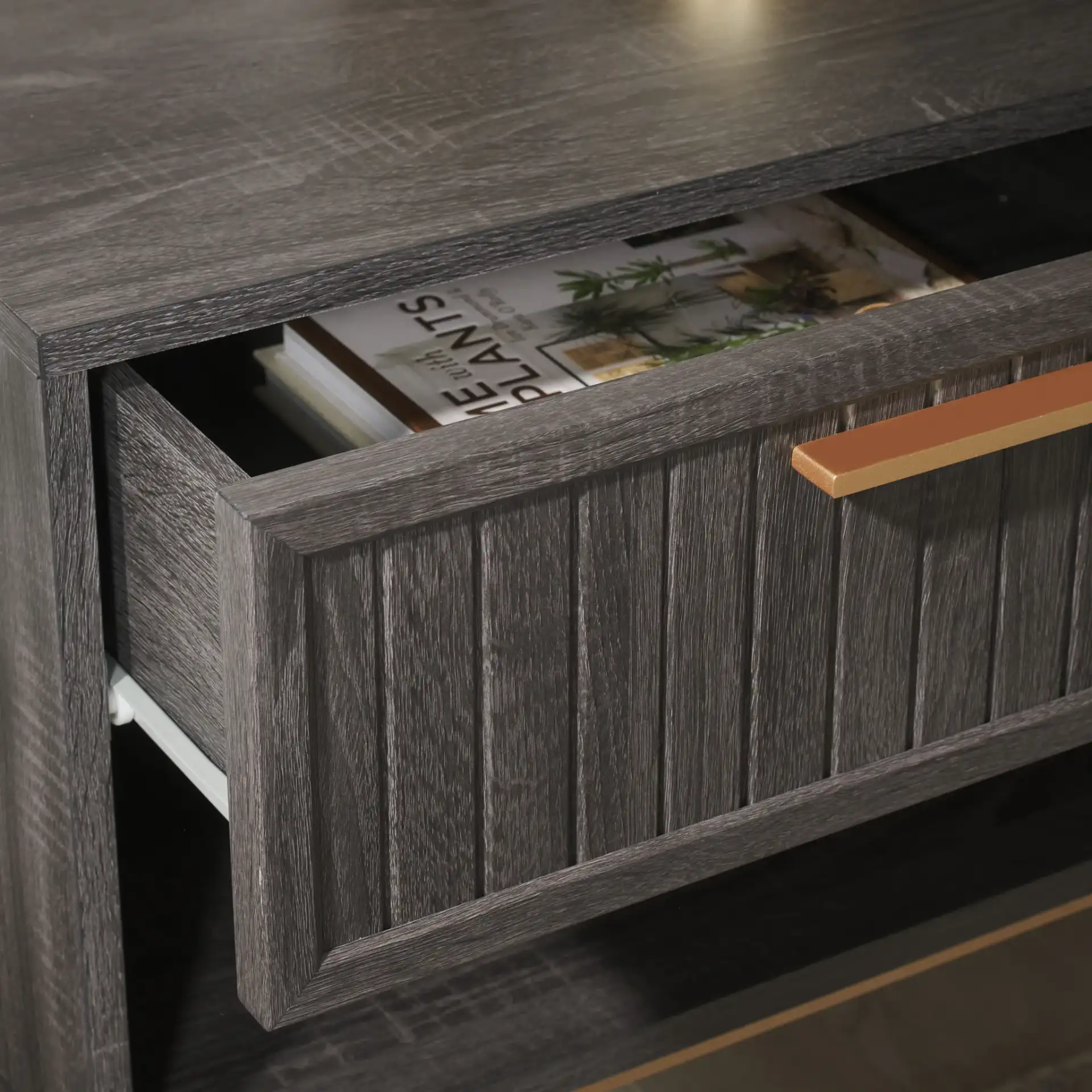 Axelle One-Drawer Nightstand in Distressed Black / Gold in a styled room