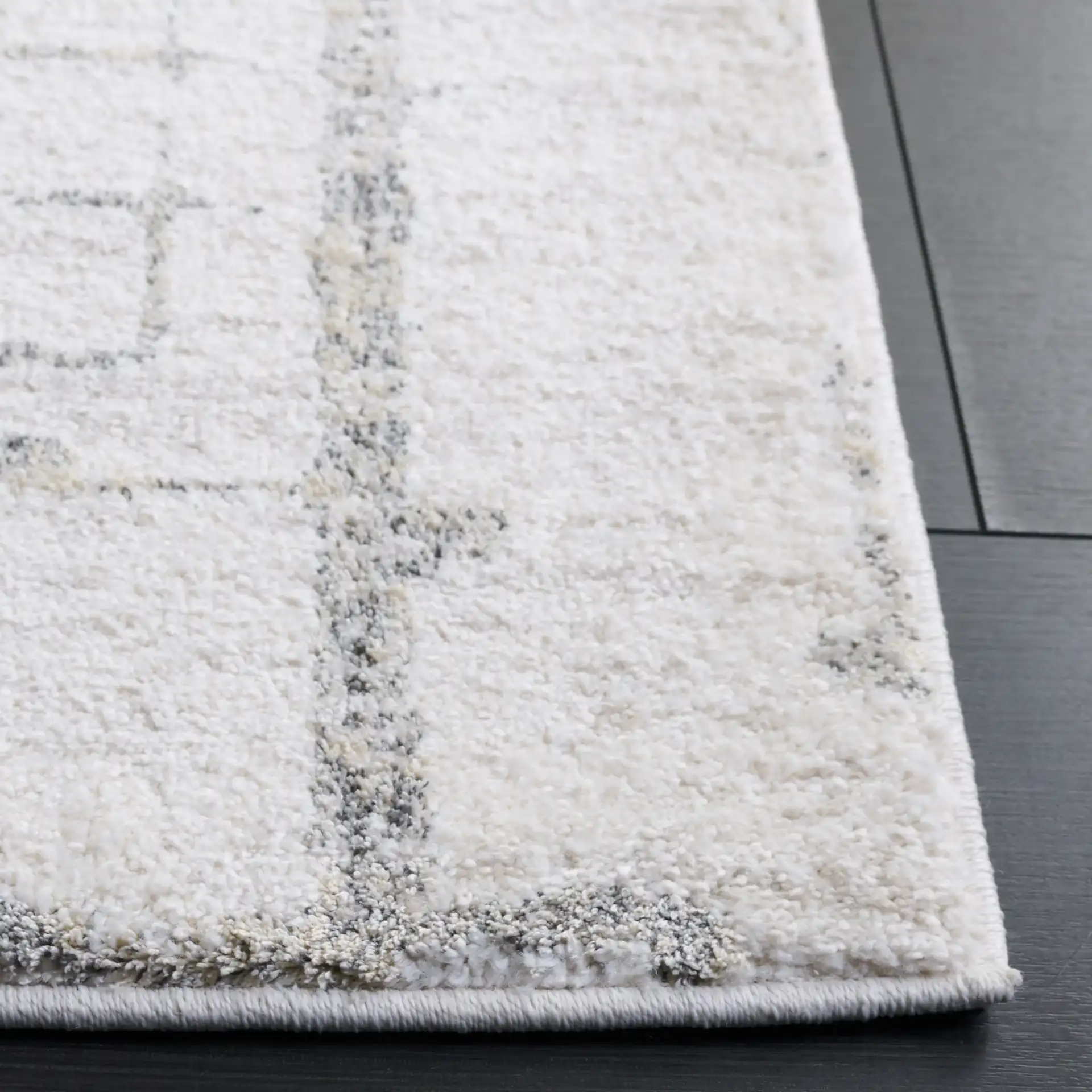 Northport Concentric Square Rug in Ivory / Gray in a styled room