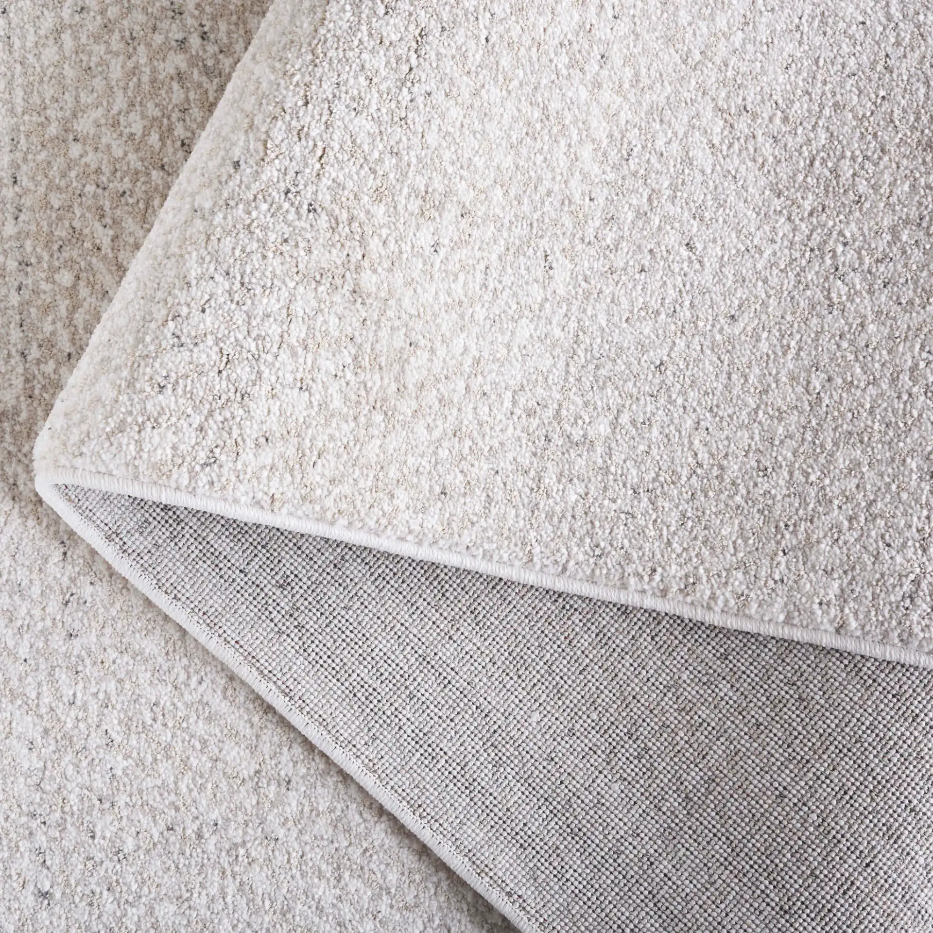 Northport Chevron Rug in Ivory / Beige in a styled room
