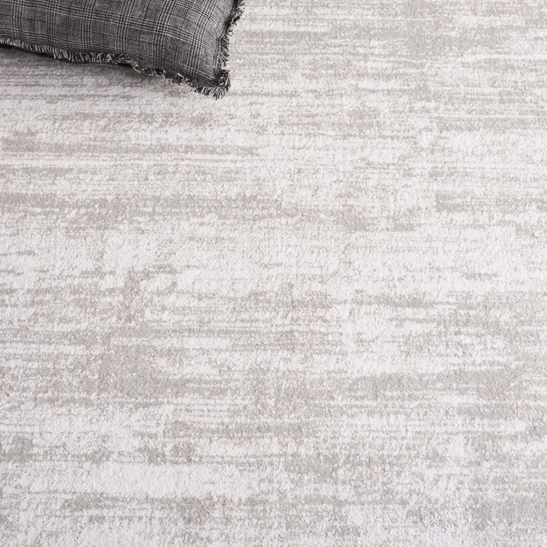 Northport Striated Border Rug in Ivory / Gray in a styled room