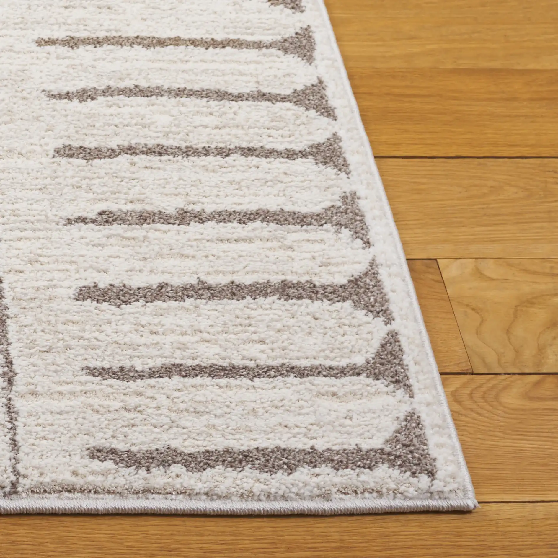 Northport Tribal Stripe Rug in Ivory / Beige in a styled room