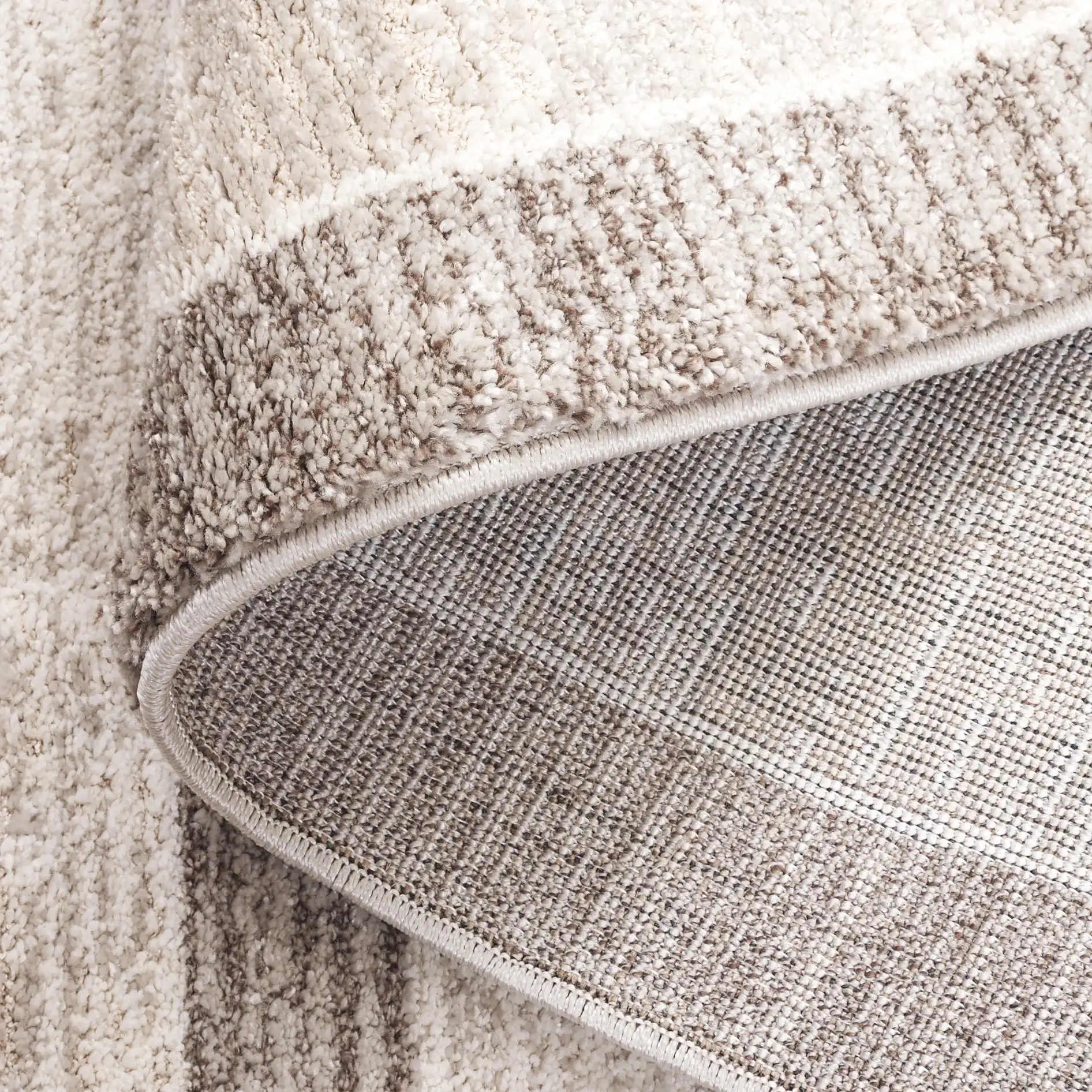 Northport Banded Stripe Rug in Ivory / Beige in a styled room