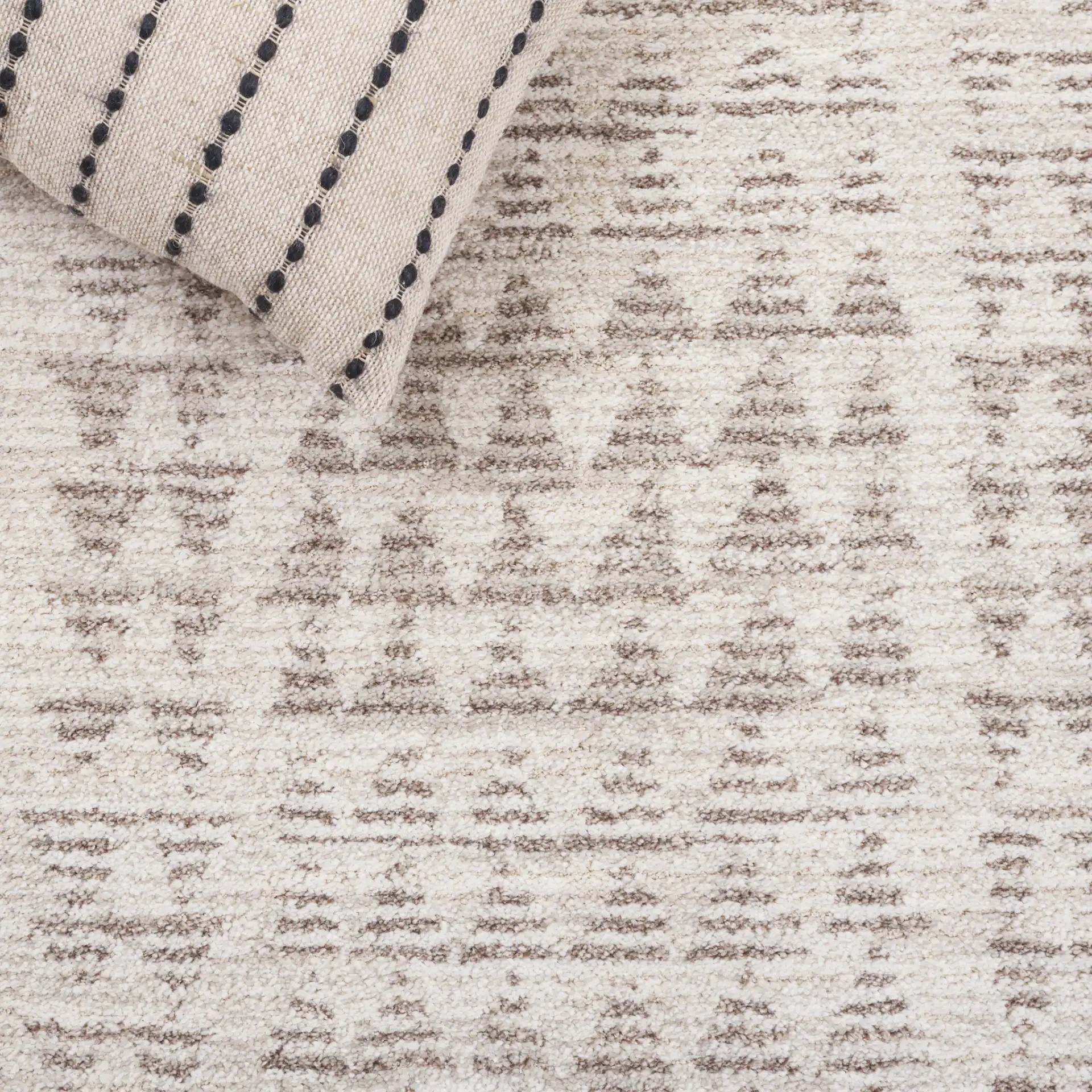 Northport Triangle Stripe Rug in Ivory / Beige in a styled room
