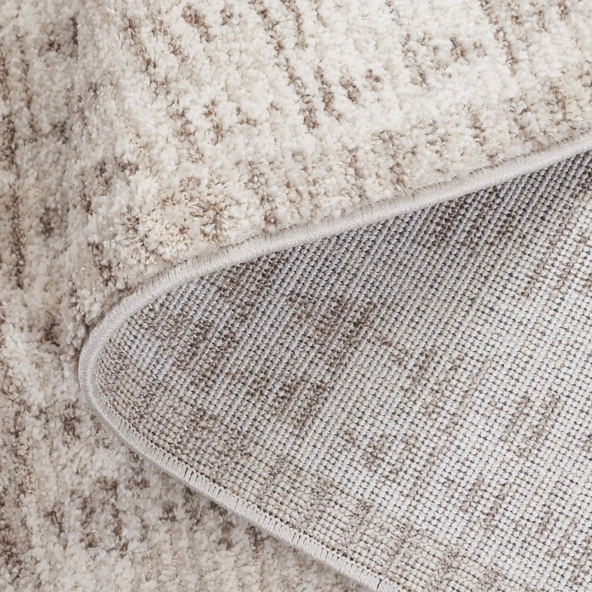 Northport Triangle Stripe Rug in Ivory / Beige in a styled room