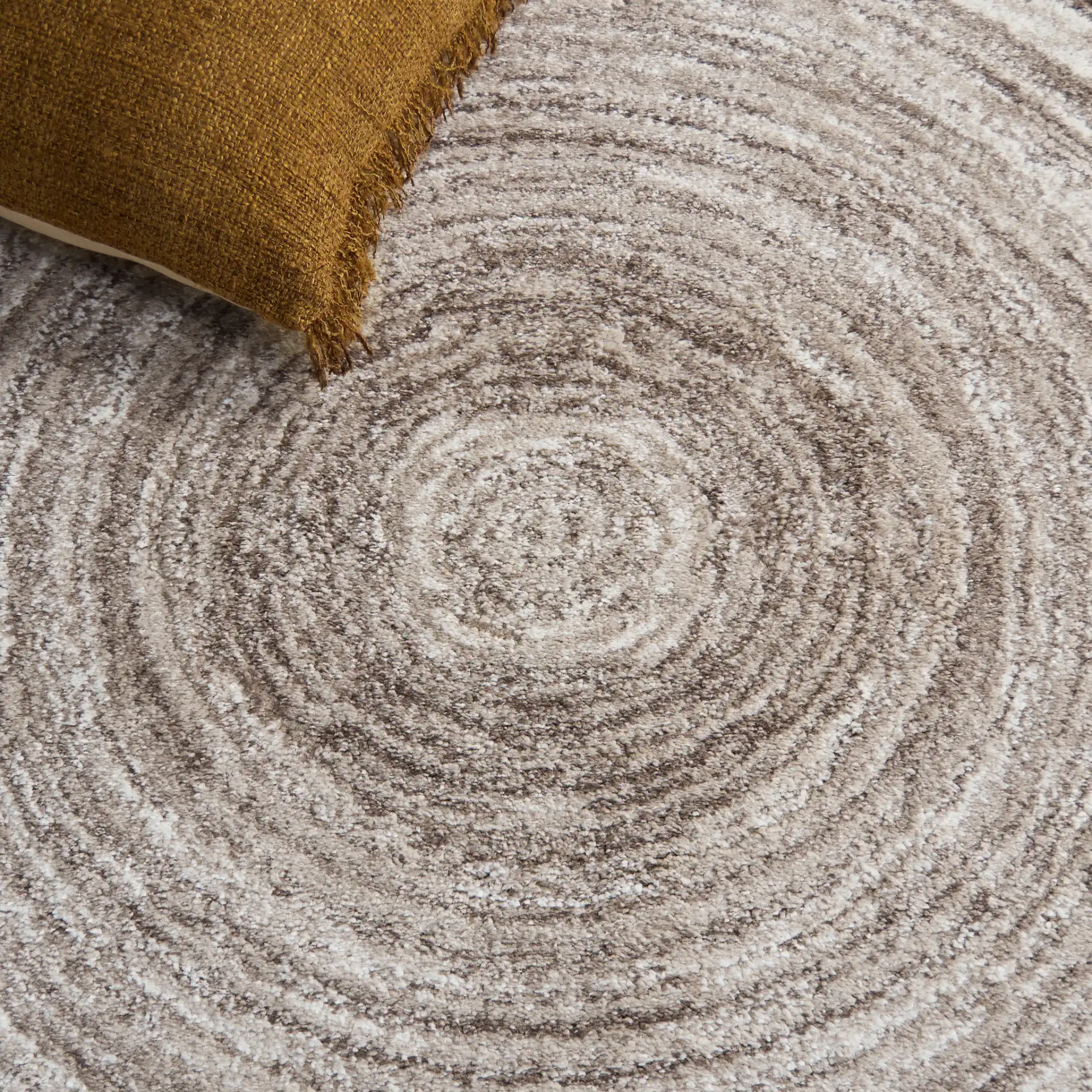 Northport Concentric Rings Rug in Taupe / Ivory in a styled room