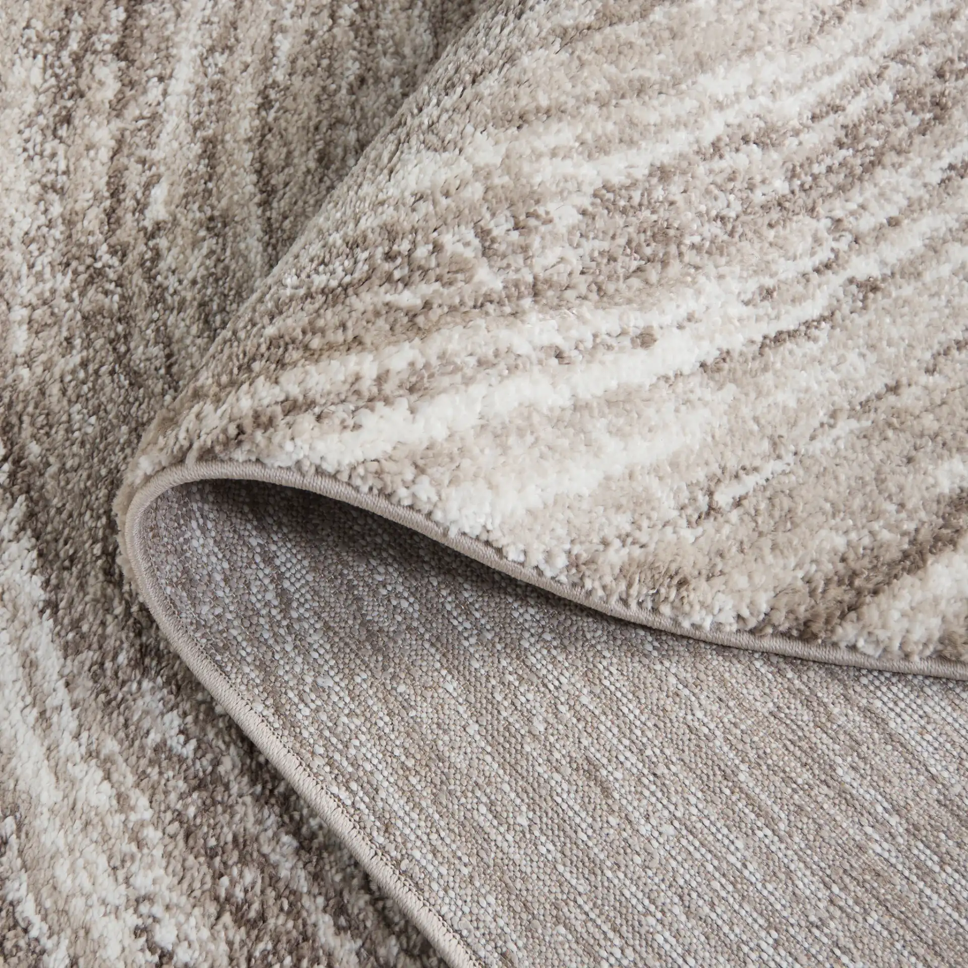 Northport Concentric Rings Rug in Taupe / Ivory in a styled room