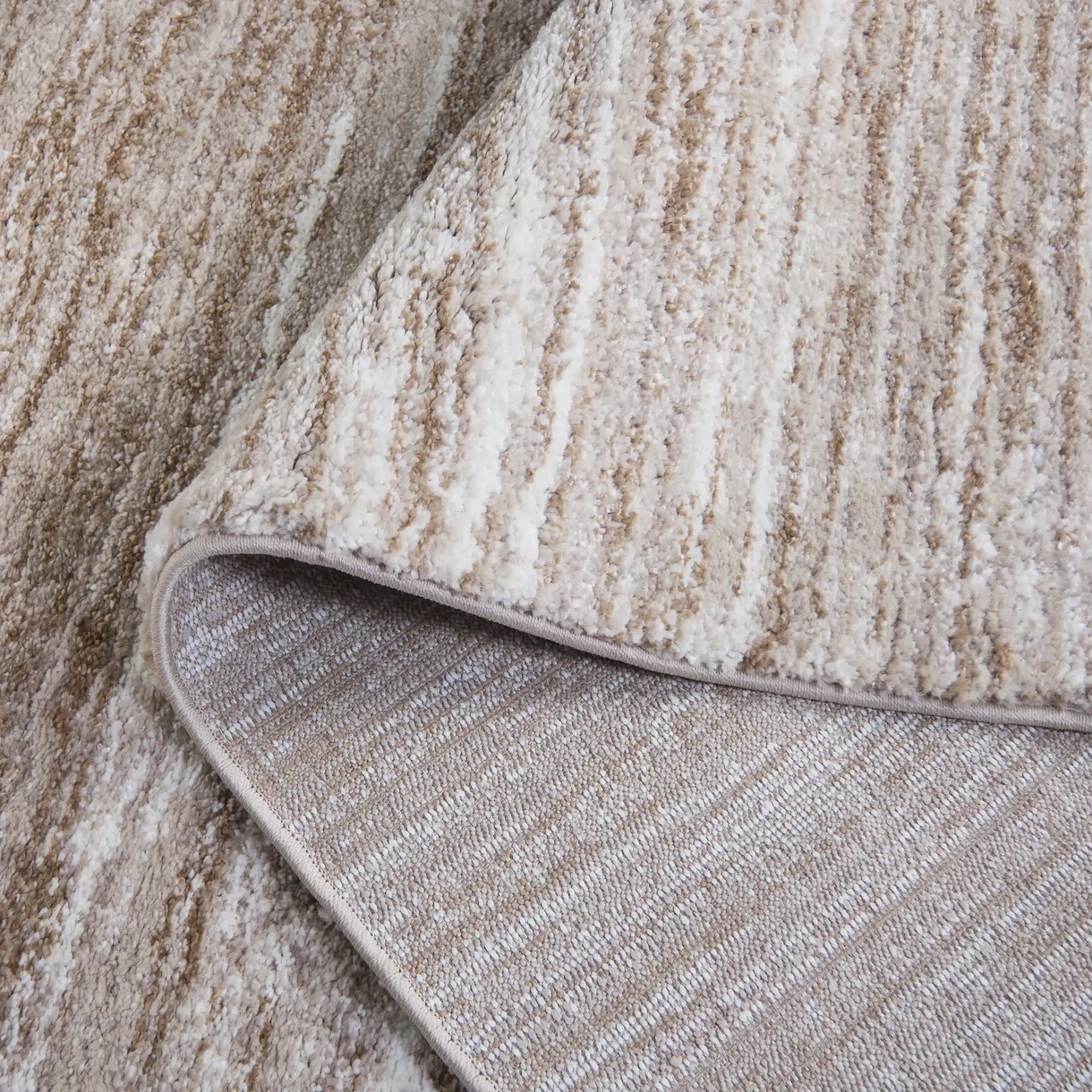 Northport Linear Abstract Rug in Taupe / Ivory in a styled room