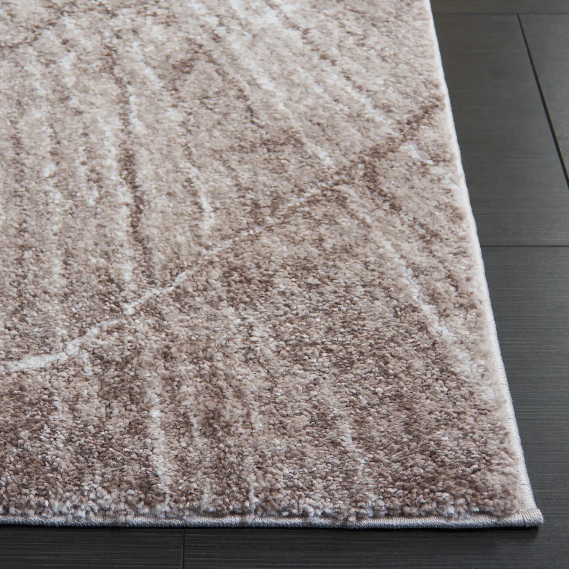 Northport Radial Ring Rug in Taupe / Ivory in a styled room
