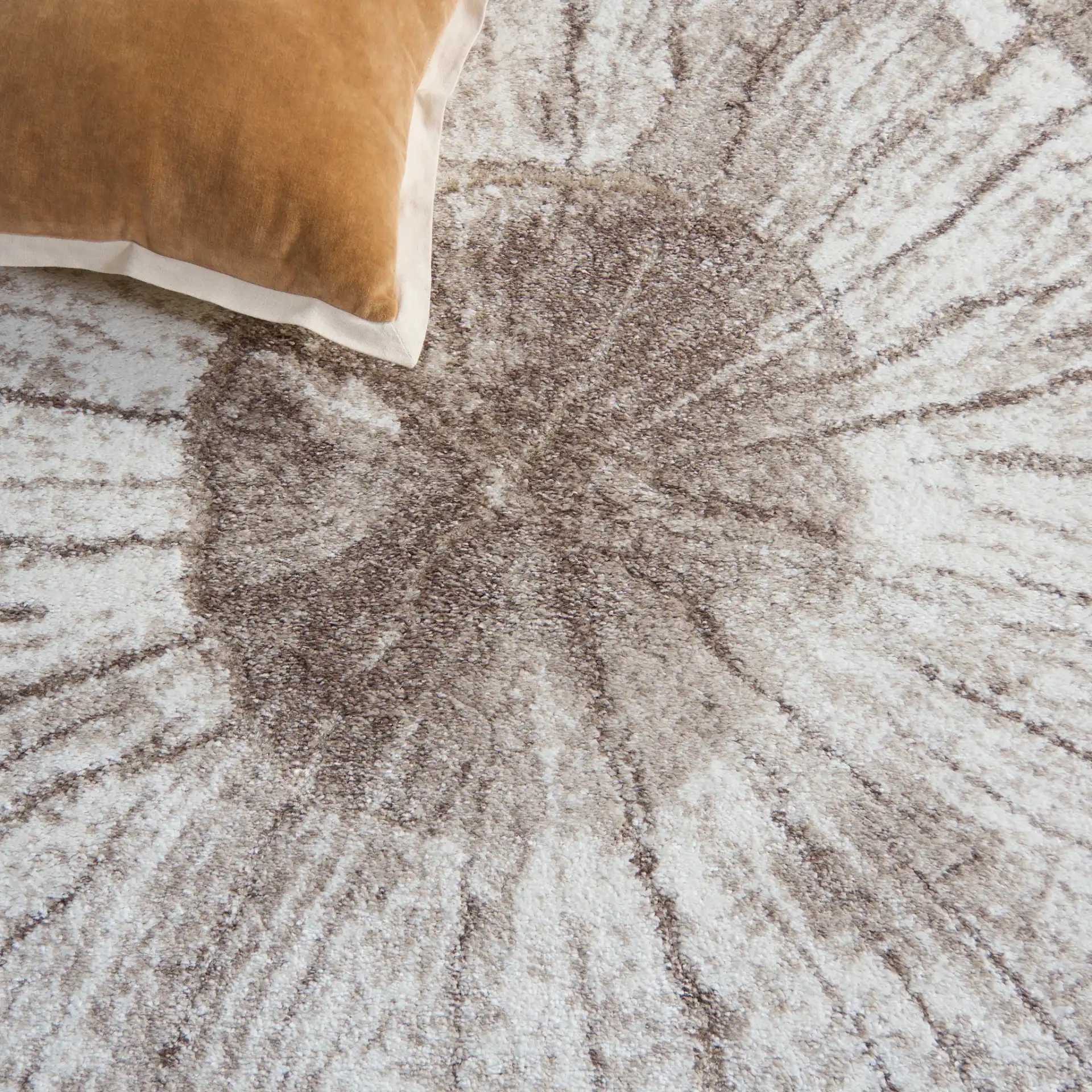 Northport Radial Ring Rug in Taupe / Ivory in a styled room