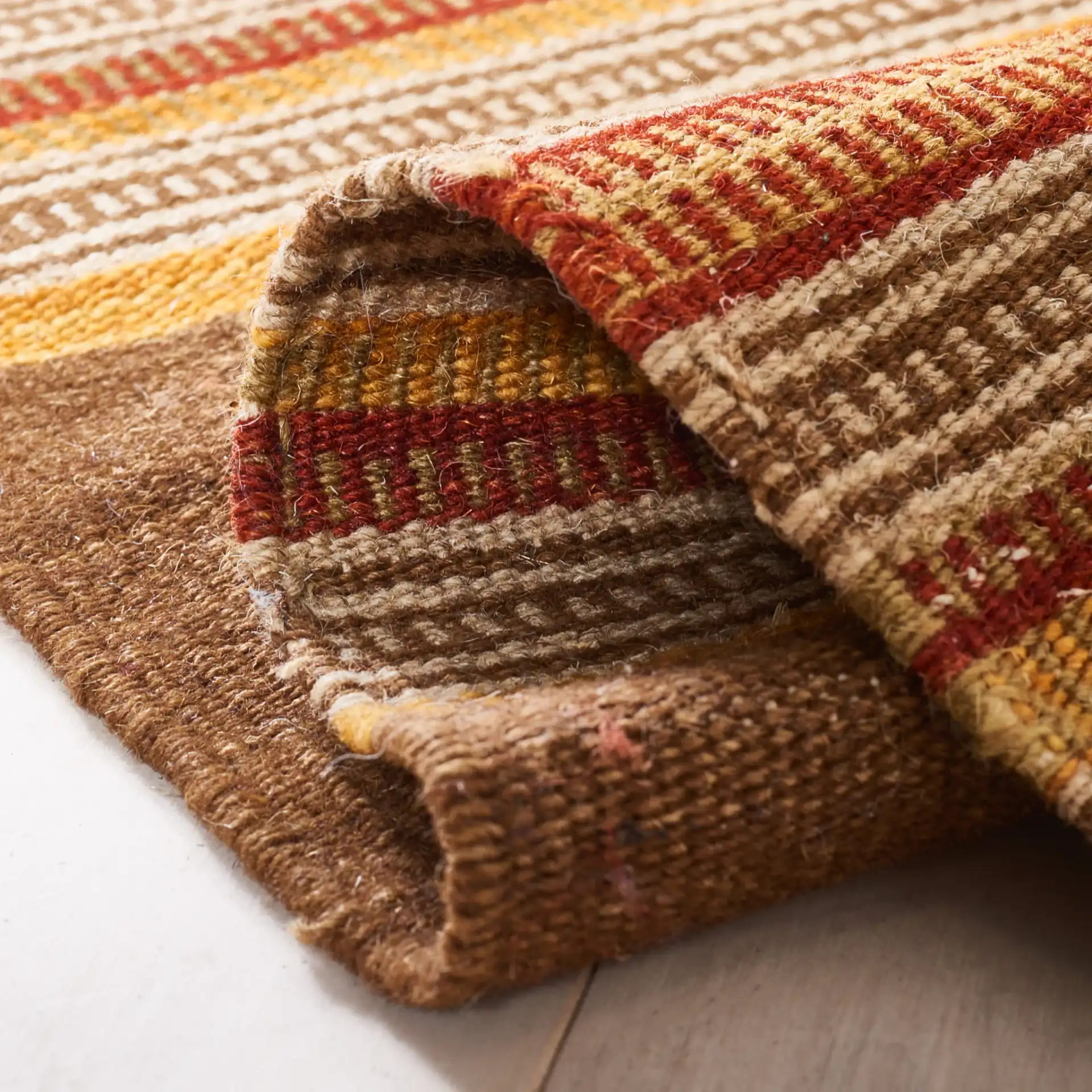 Kilim Diamond Stripe Hand-Woven Wool Rug in Natural / Multicolor in a styled room