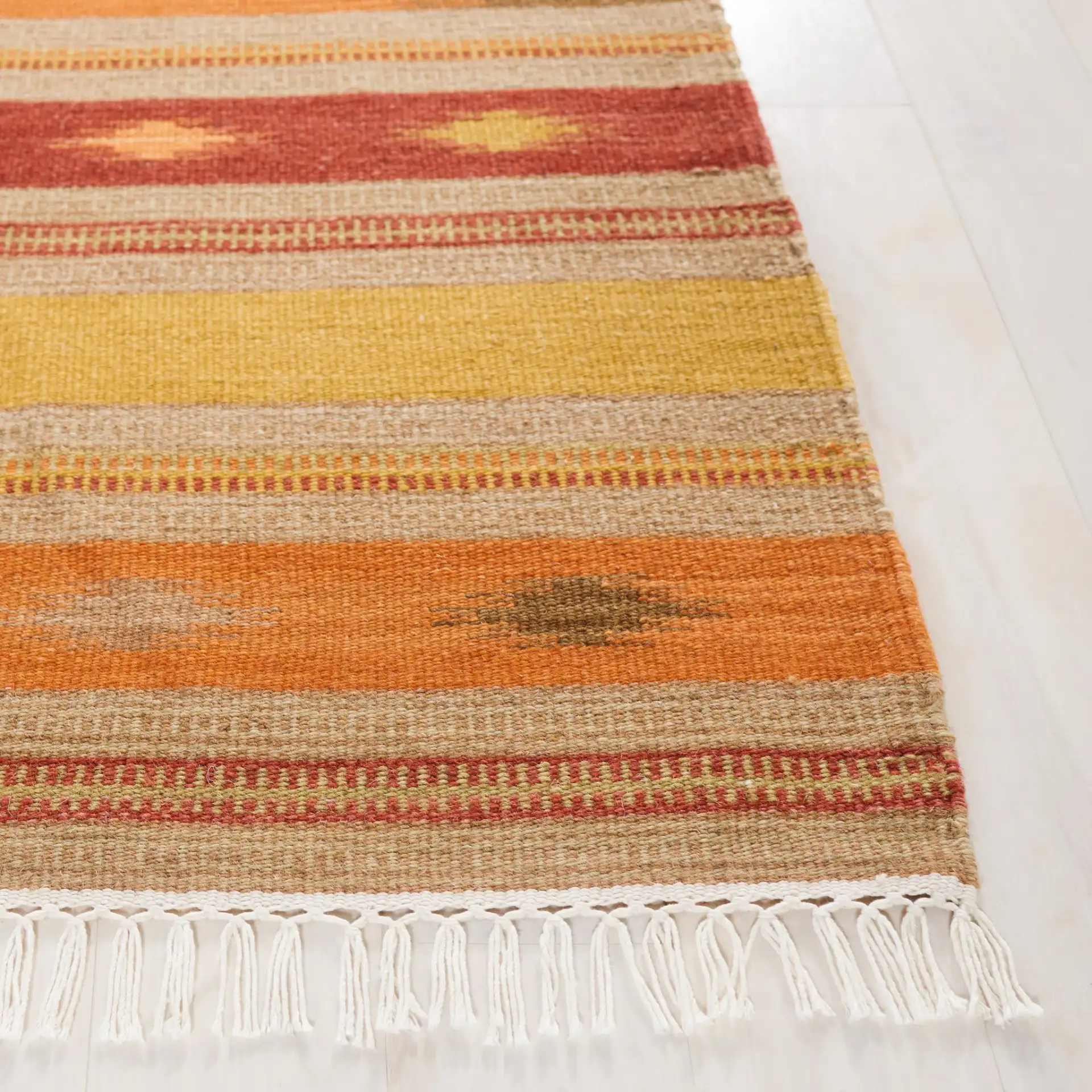 Kilim Southwestern Striped Hand-Woven Wool Rug in Brown / Multicolor in a styled room