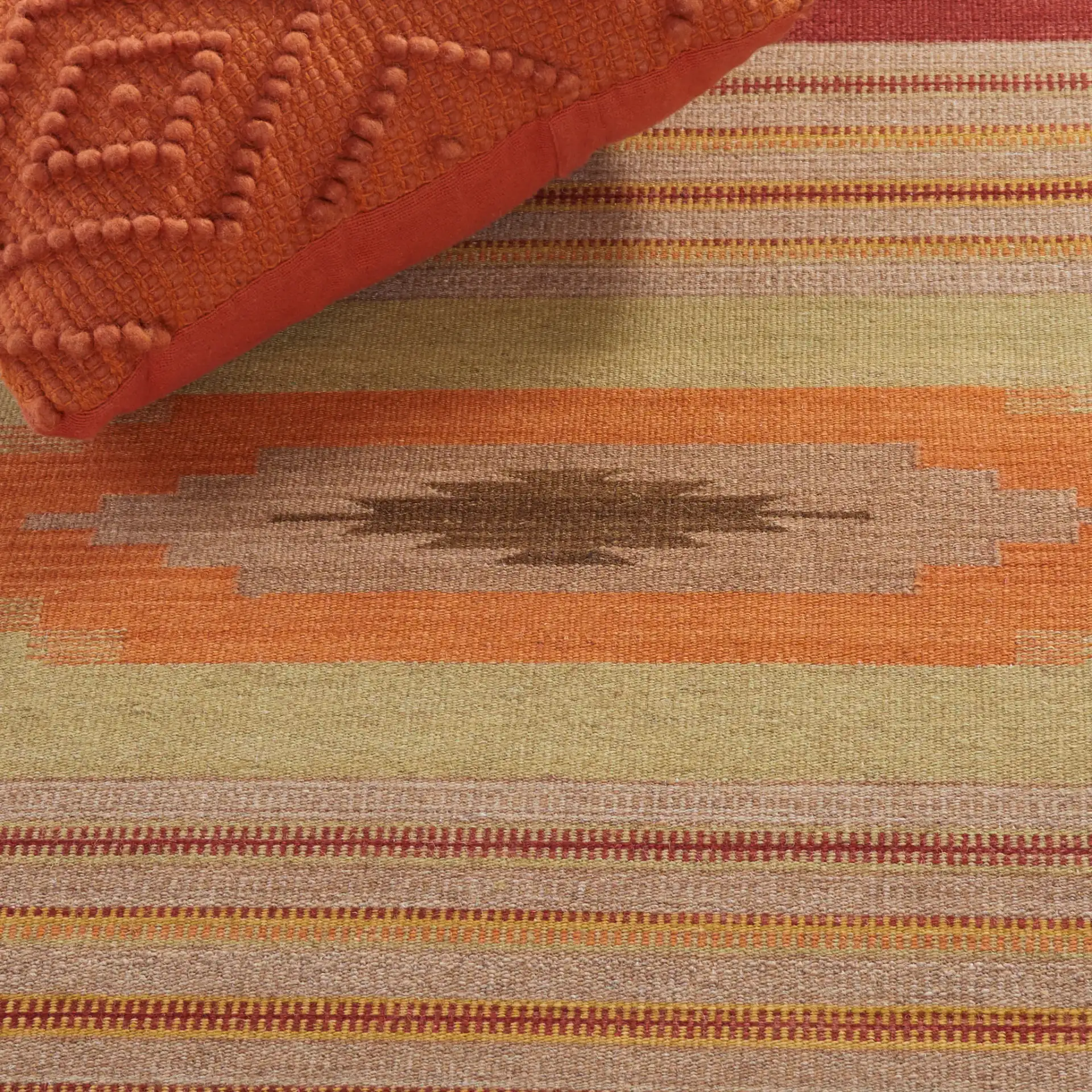 Kilim Southwestern Striped Hand-Woven Wool Rug in Brown / Multicolor in a styled room