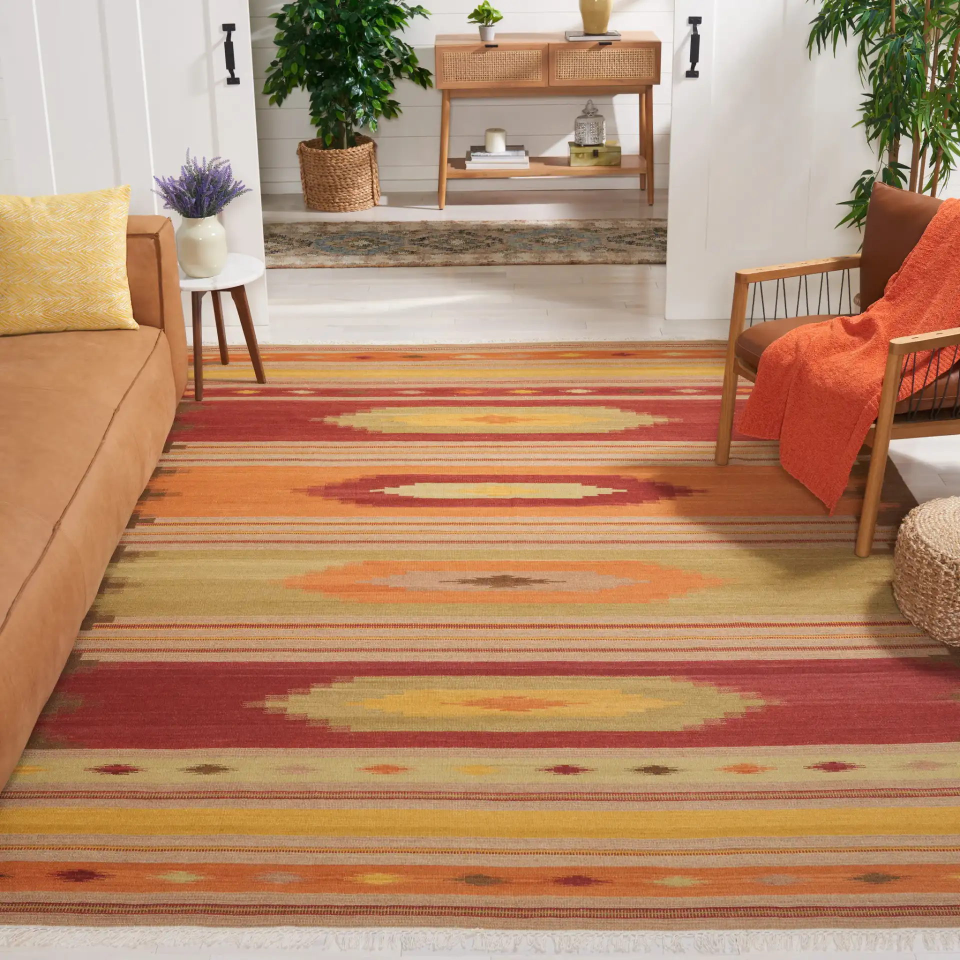 Kilim Southwestern Striped Hand-Woven Wool Rug in Brown / Multicolor in a styled room