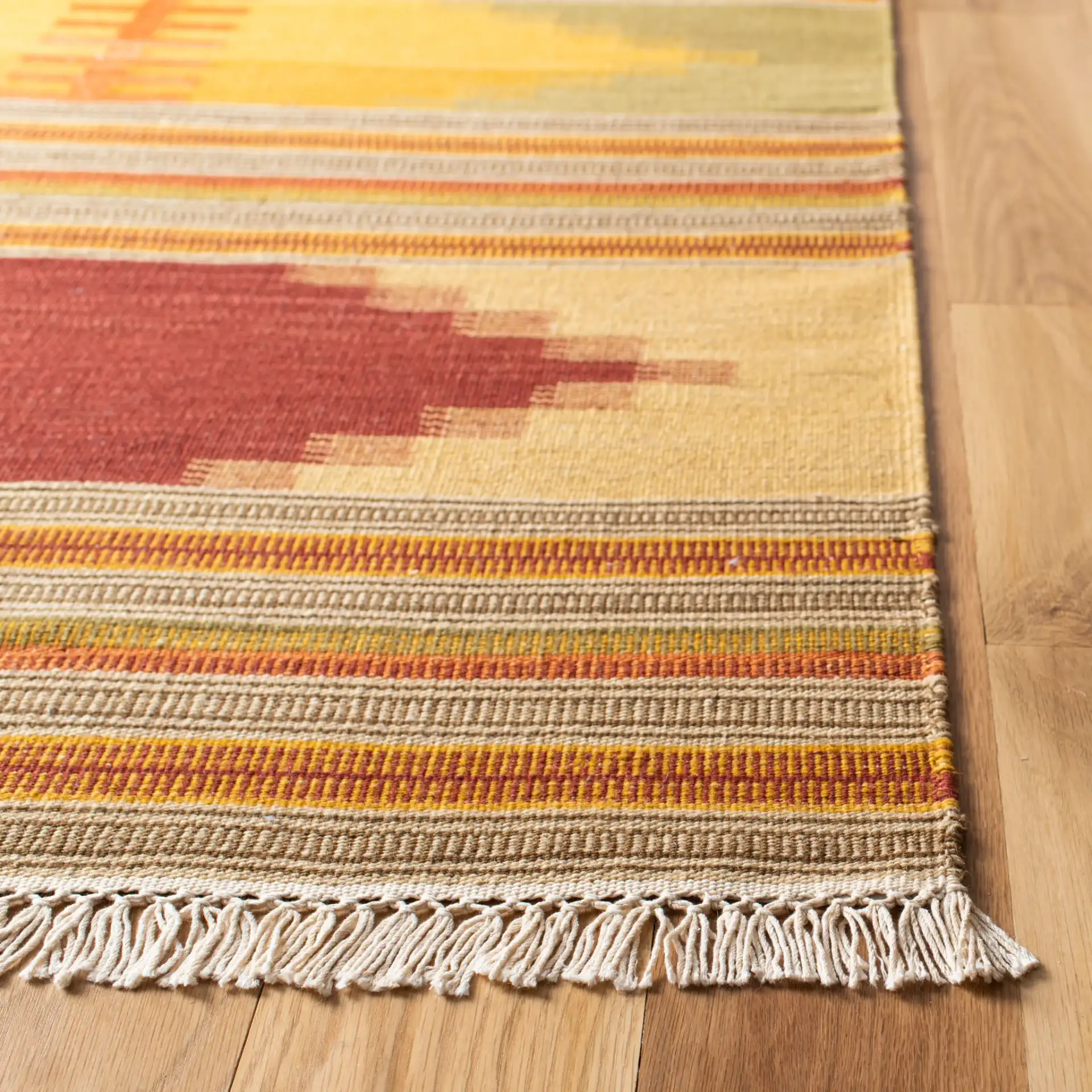 Kilim Striped Diamond Hand-Woven Wool Rug in Red / Multicolor in a styled room