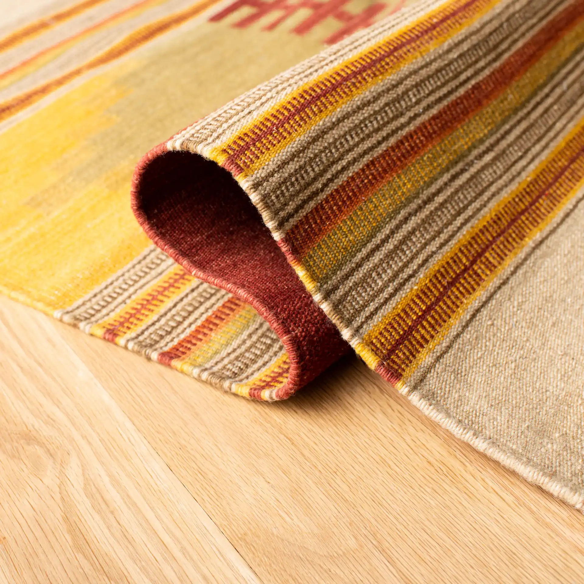 Kilim Striped Diamond Hand-Woven Wool Rug in Red / Multicolor in a styled room
