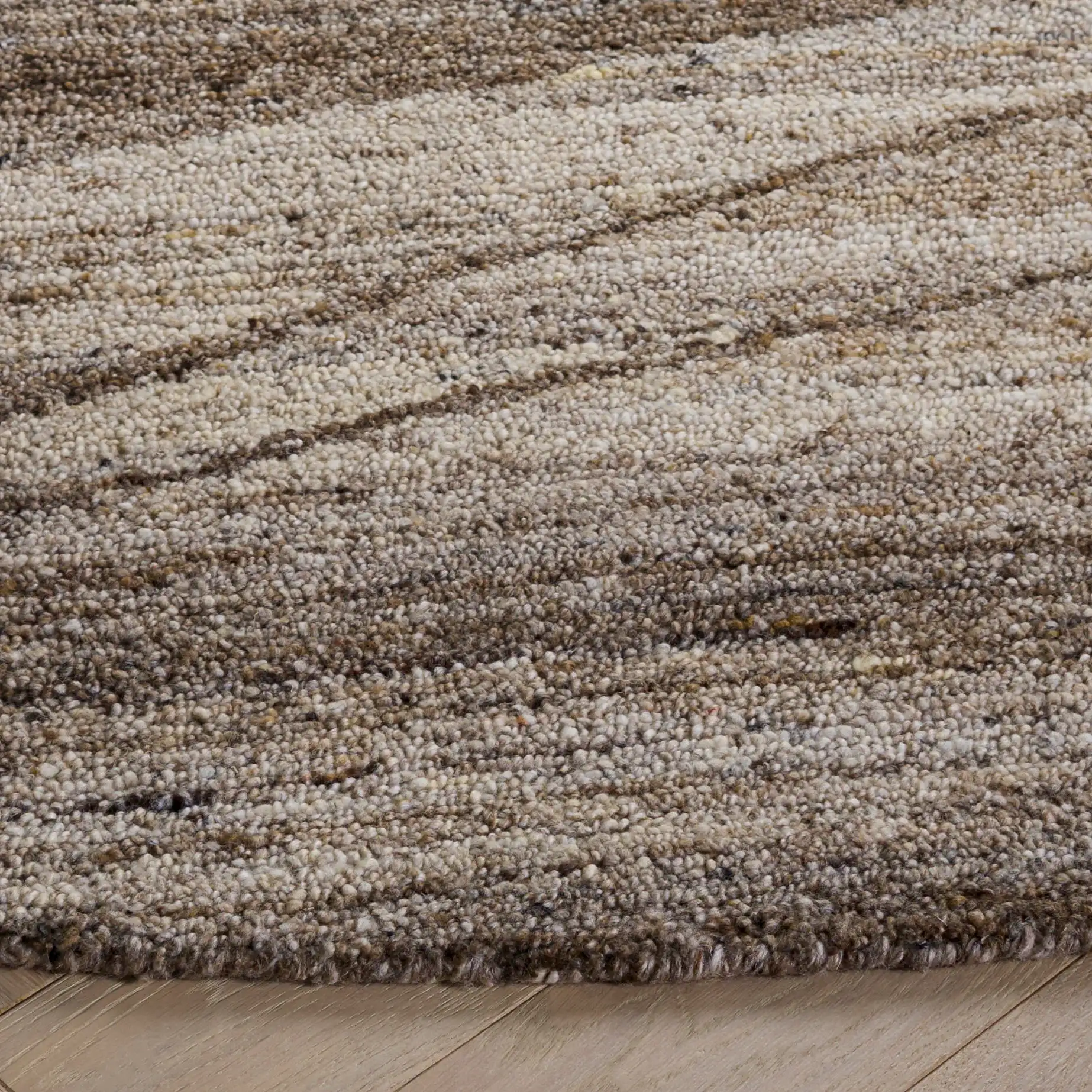 Oakwood Wave Hand-Tufted Wool Rug in Natural / Gray in a styled room