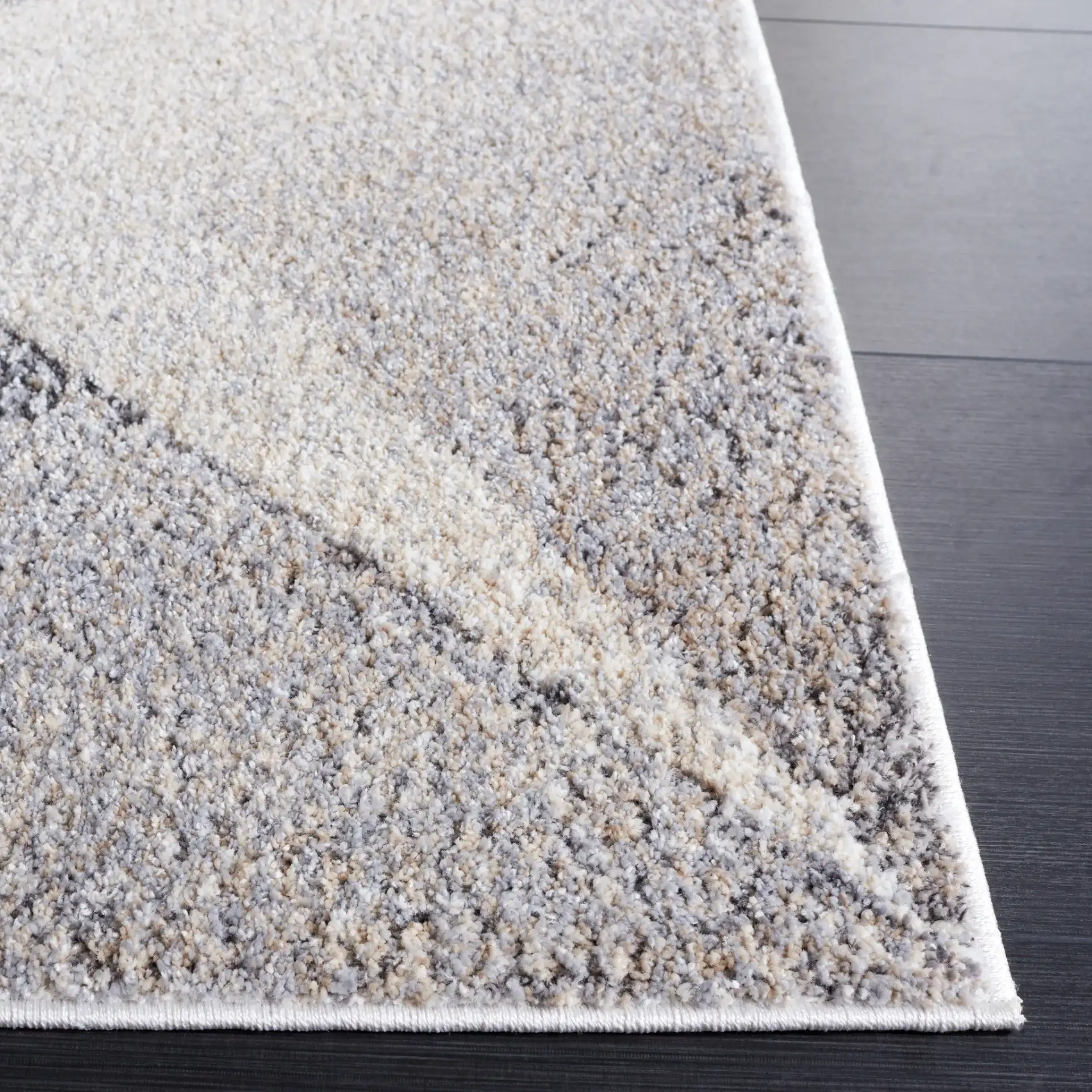 Opal Intersecting Planes Rug in Gray / Ivory in a styled room