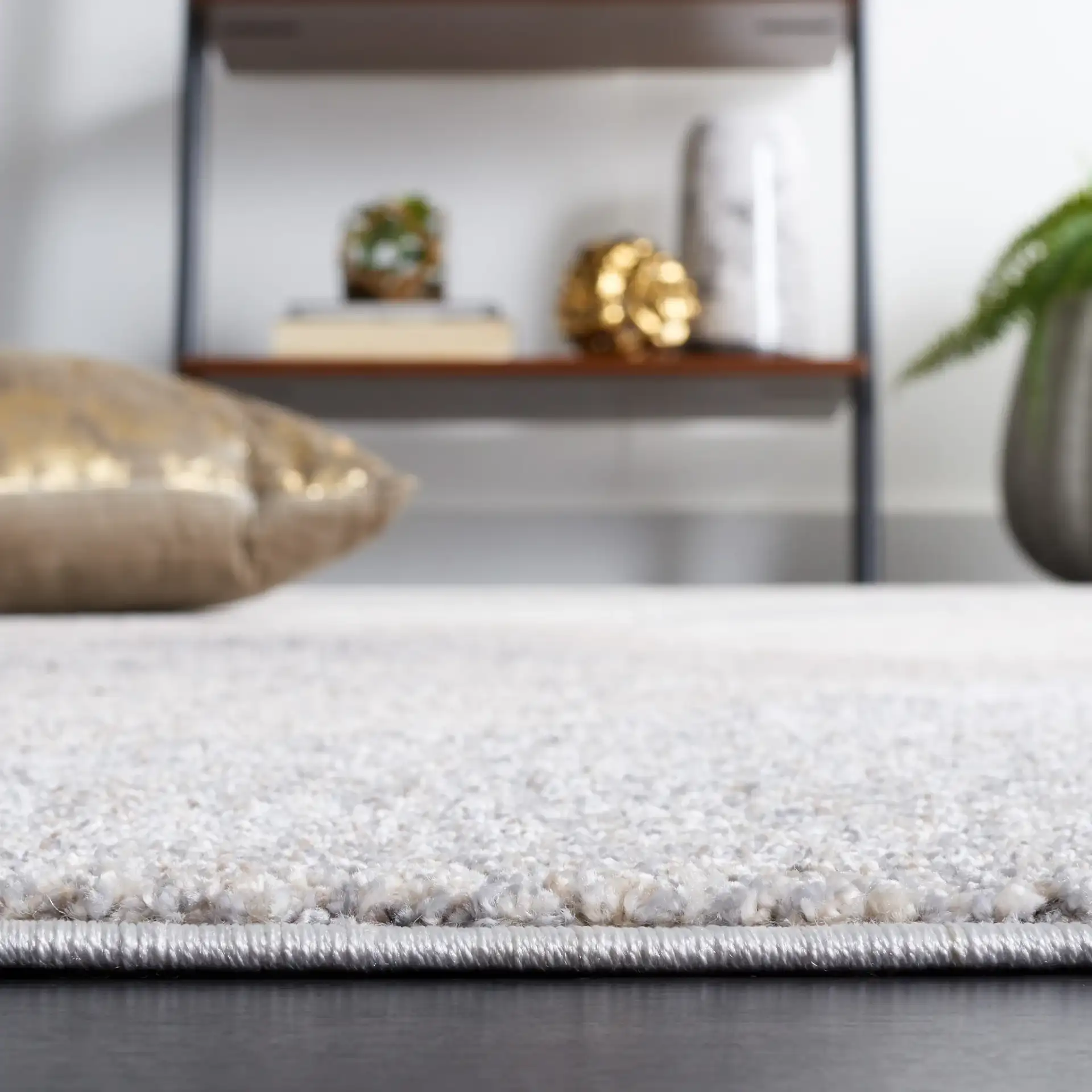 Opal Intersecting Planes Rug in Gray / Ivory in a styled room