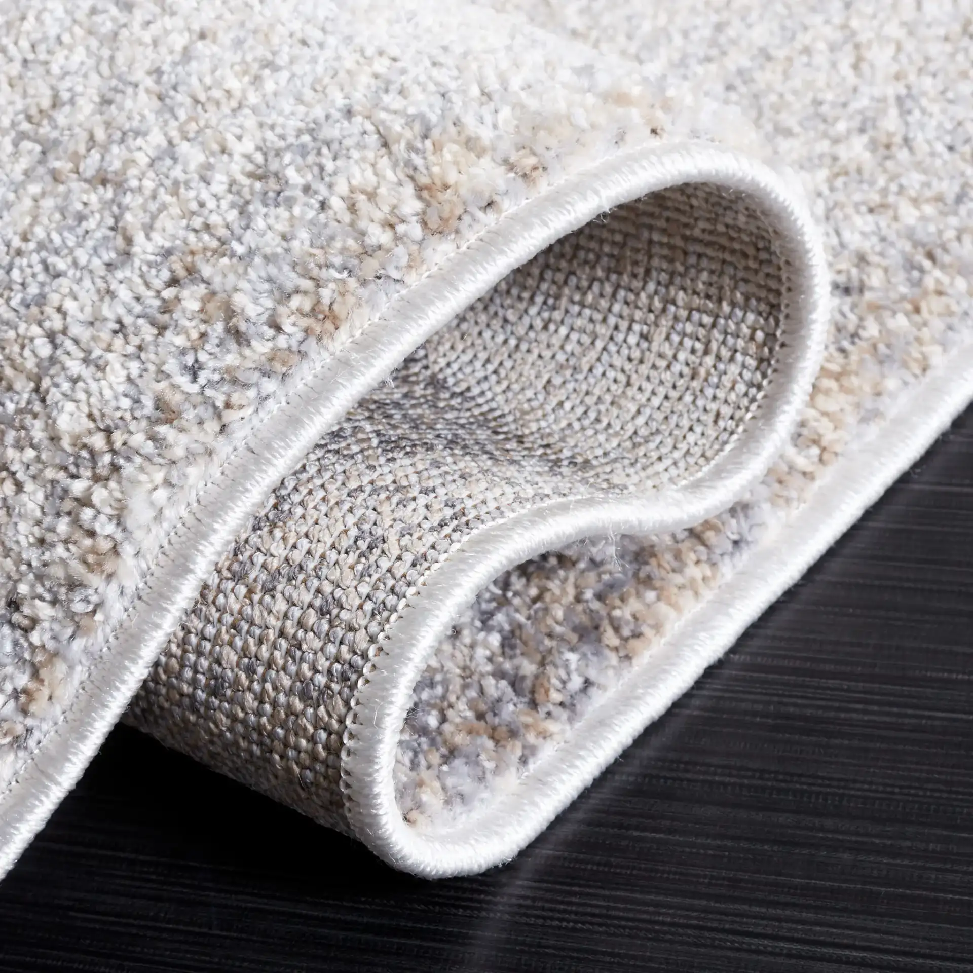 Opal Intersecting Planes Rug in Gray / Ivory in a styled room