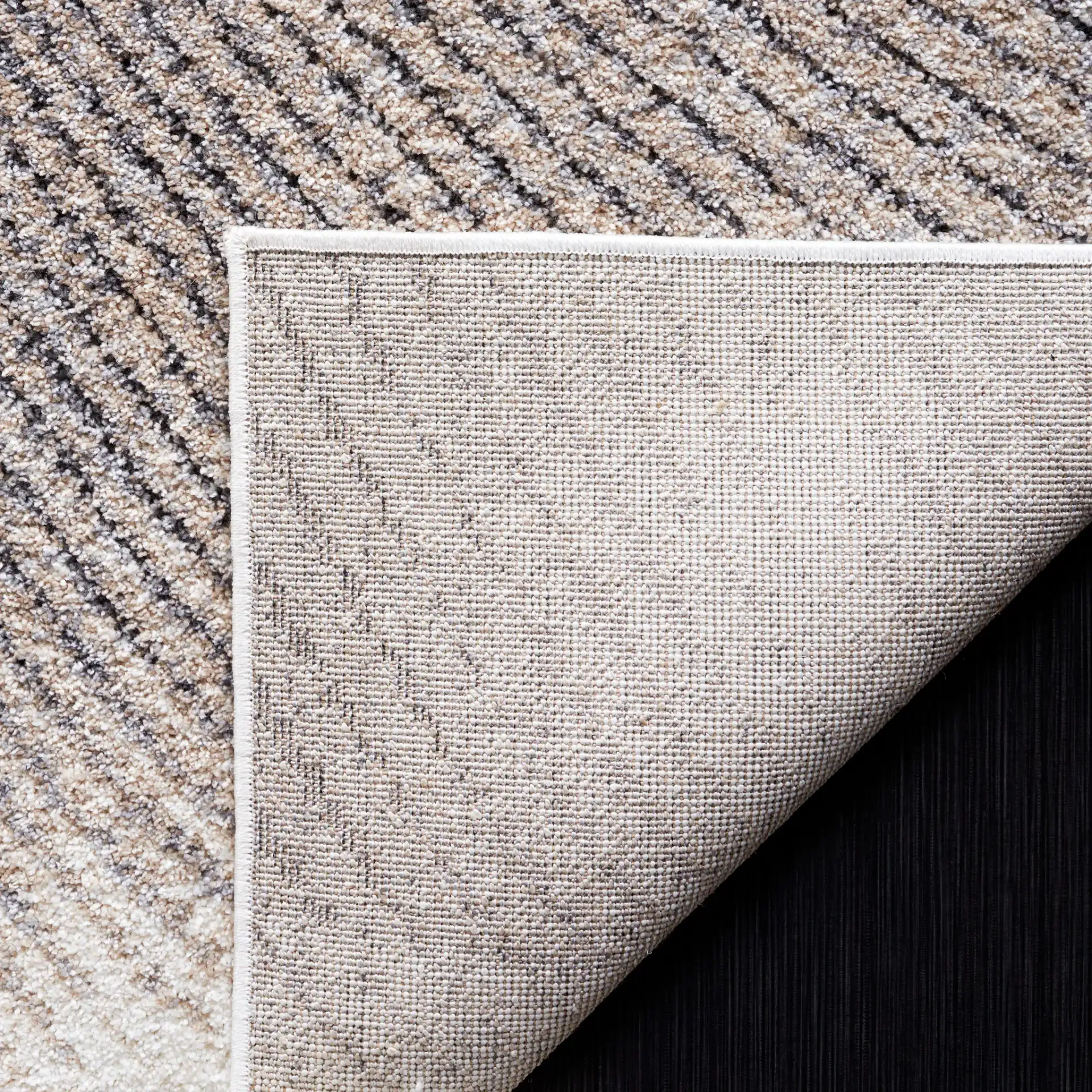 Opal Intersecting Planes Rug in Gray / Ivory in a styled room