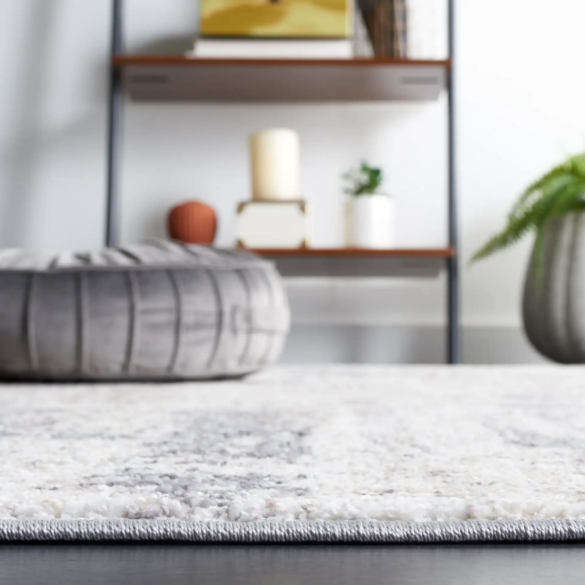 Opal Distressed Block Rug in Ivory / Gray in a styled room