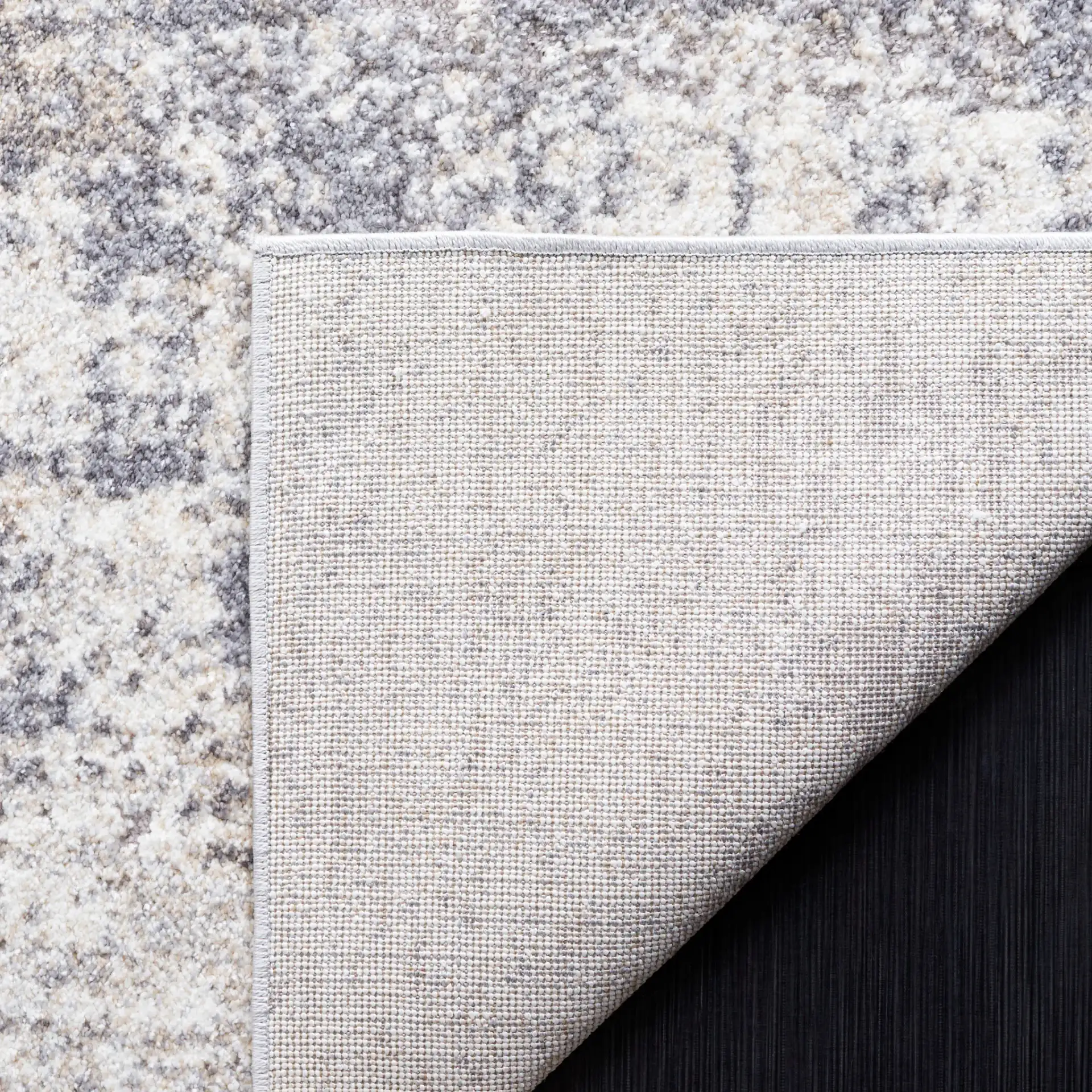 Opal Distressed Block Rug in Ivory / Gray in a styled room