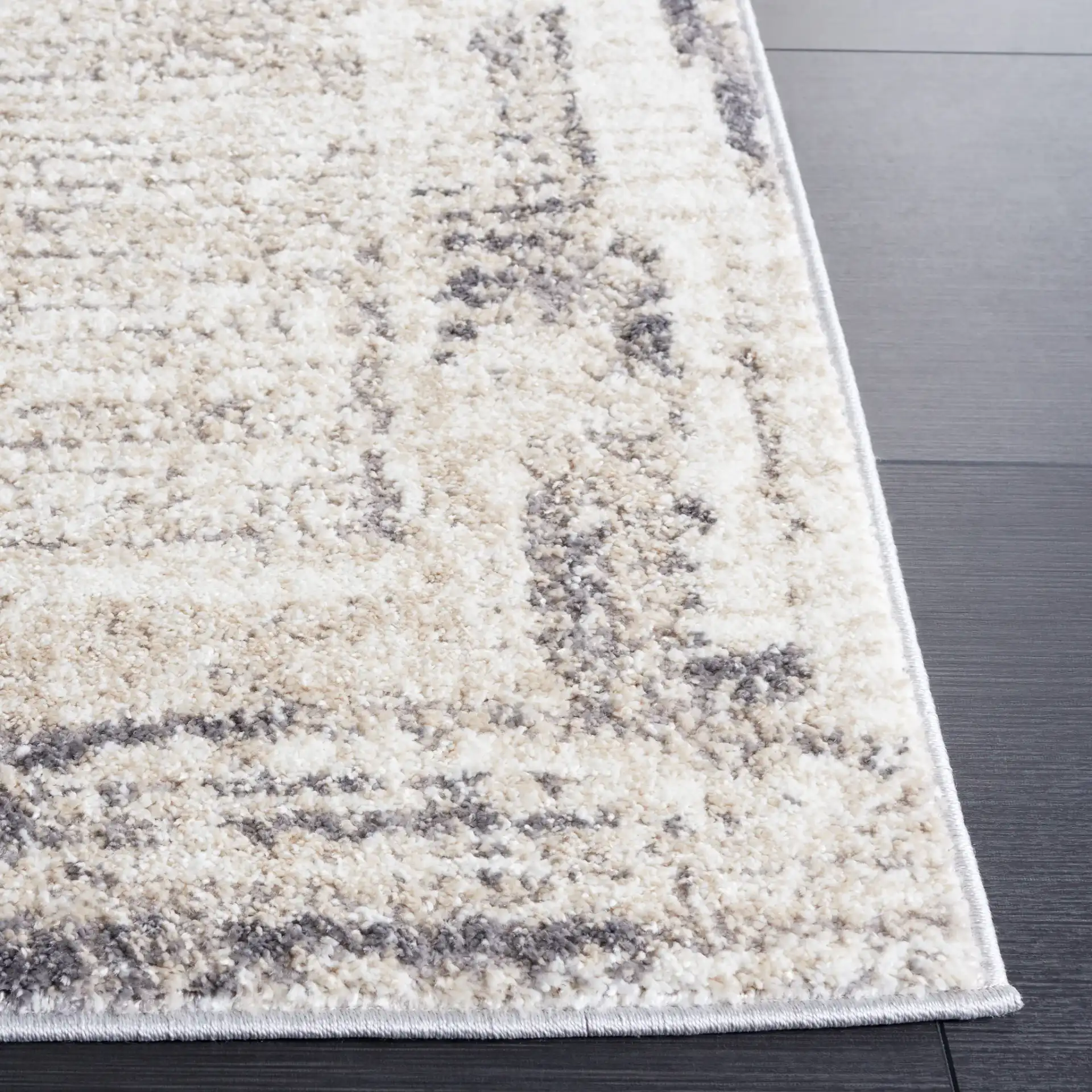 Opal Abstract Border Rug in Ivory / Gray in a styled room
