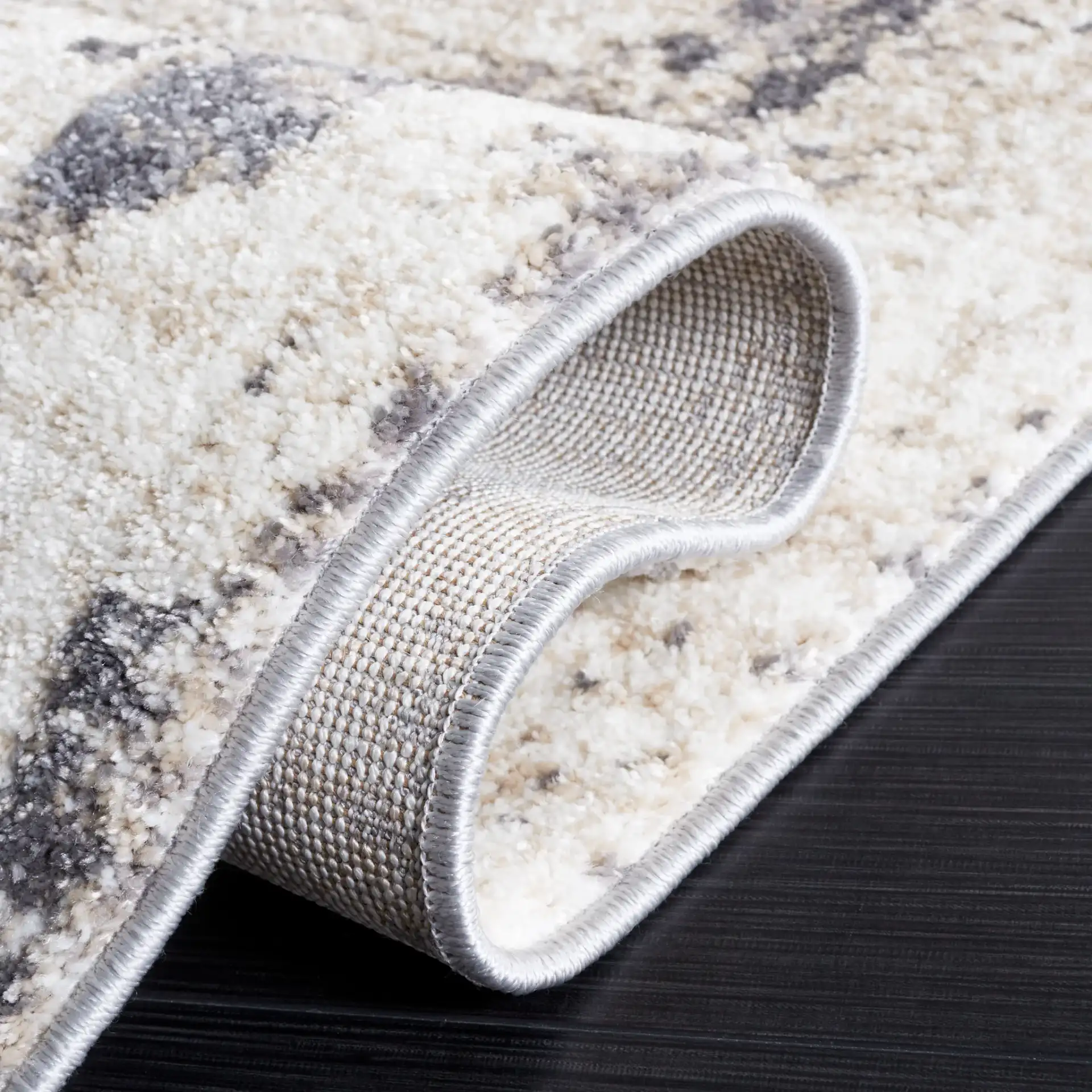 Opal Abstract Border Rug in Ivory / Gray in a styled room