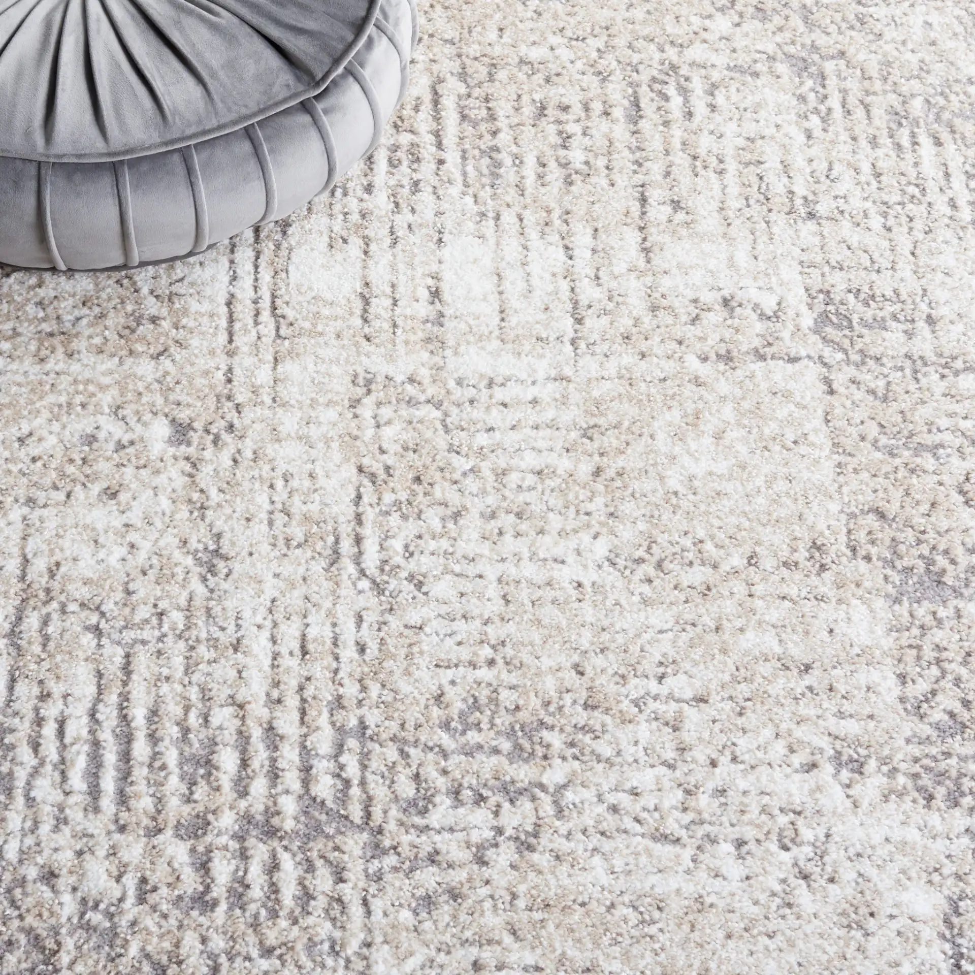 Opal Abstract Border Rug in Ivory / Gray in a styled room