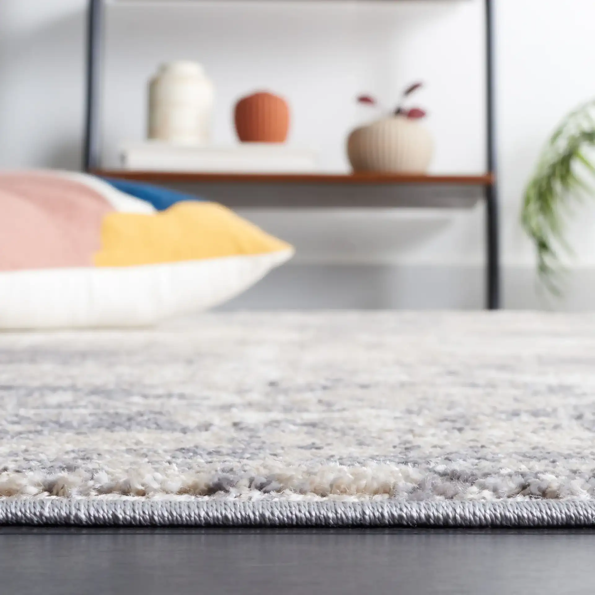 Opal Distressed Abstract Rug in Gray / Beige in a styled room