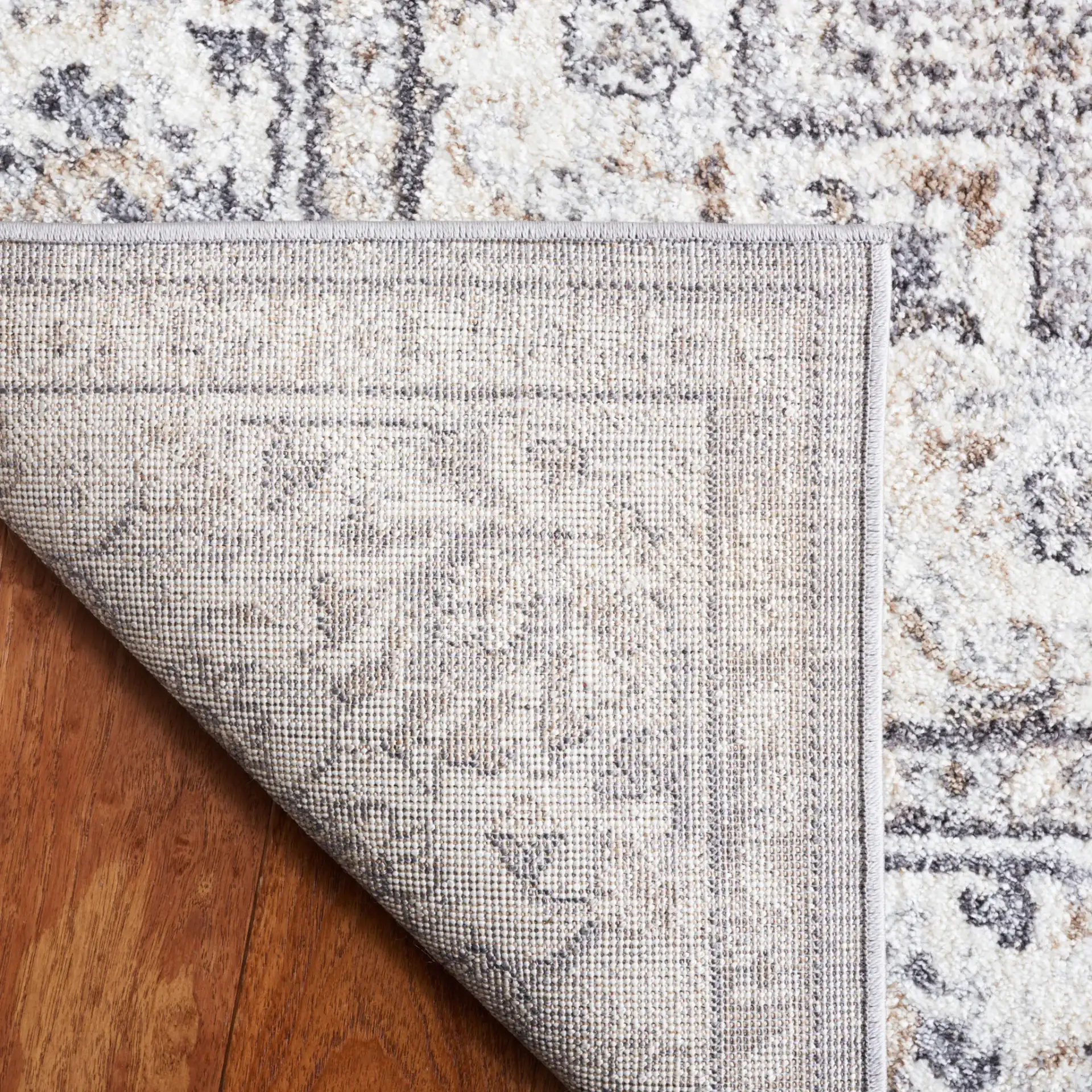 Opal Medallion Rug in Gray / Ivory in a styled room