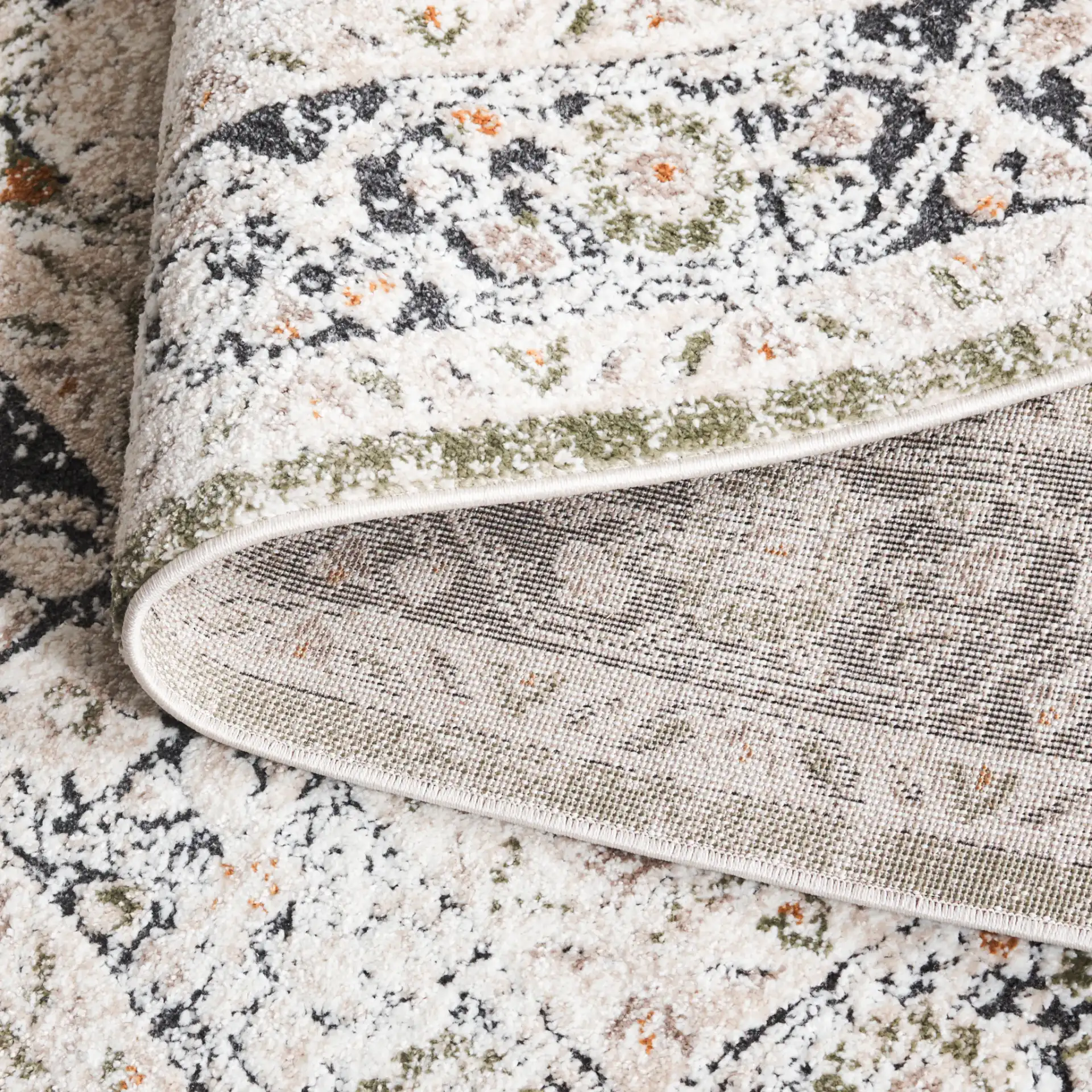 Opal Vintage Medallion Rug in Green / Beige in a styled room