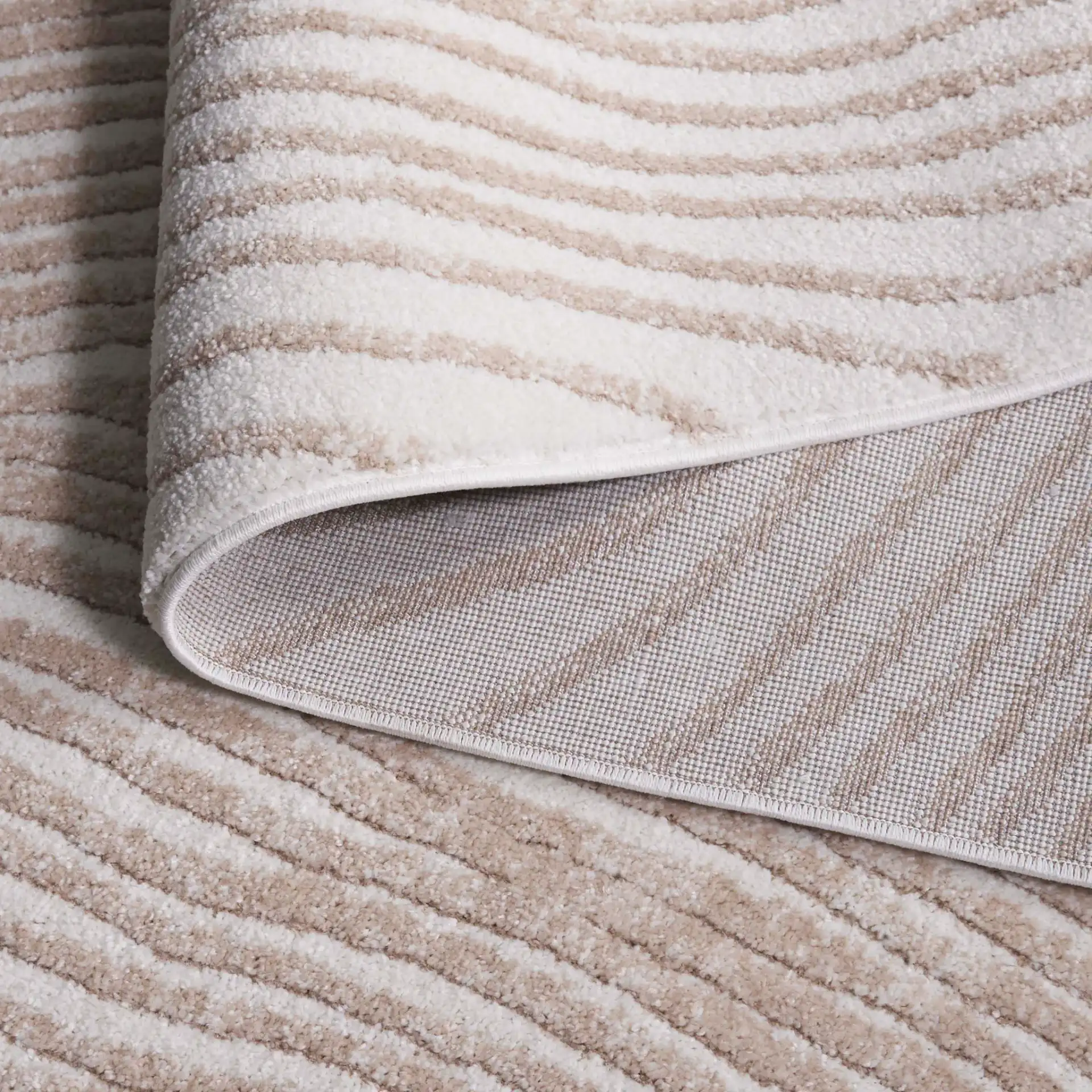 Opal Concentric Wave Rug in Ivory / Beige in a styled room