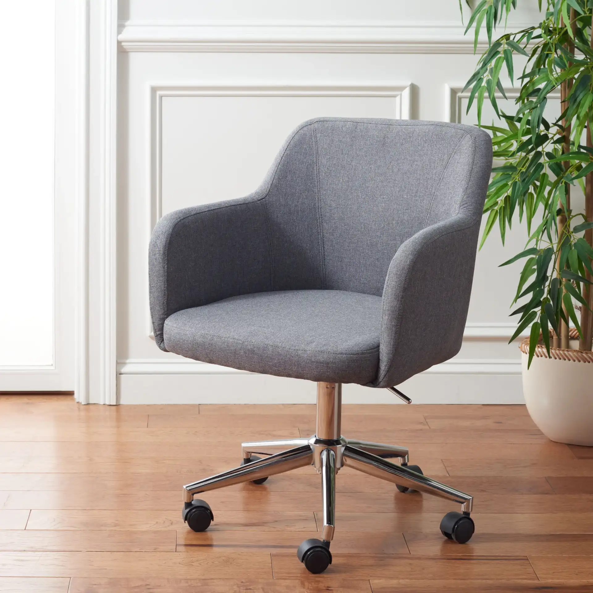 Kains Swivel Office Chair in Gray / Chrome in a styled room