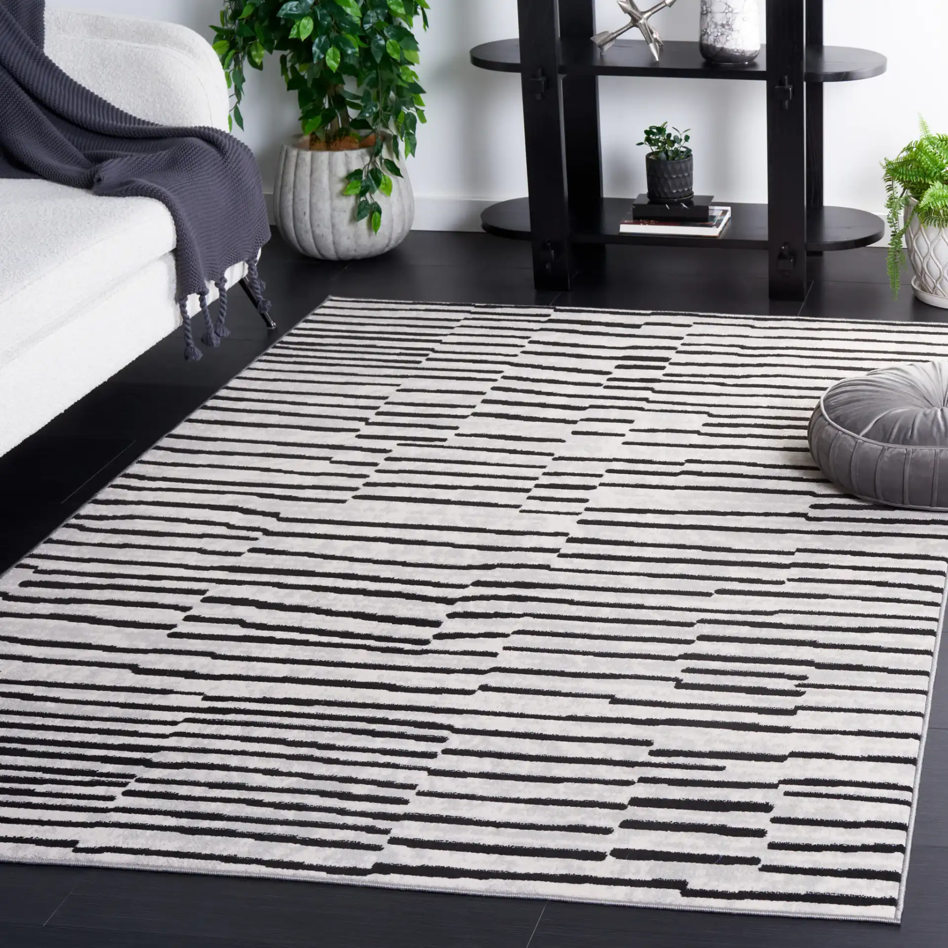 Odyssey Broken Stripe Rug in Gray / Black in a styled room