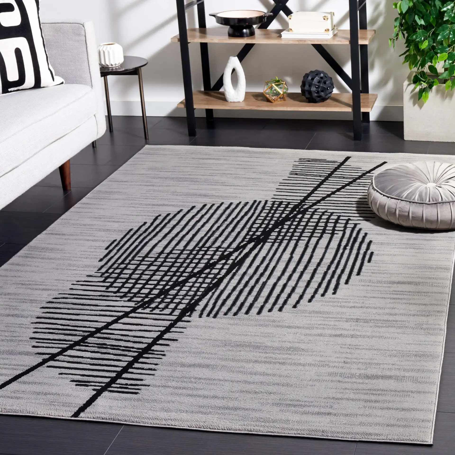 Odyssey Abstract Grid Rug in Gray / Gold in a styled room