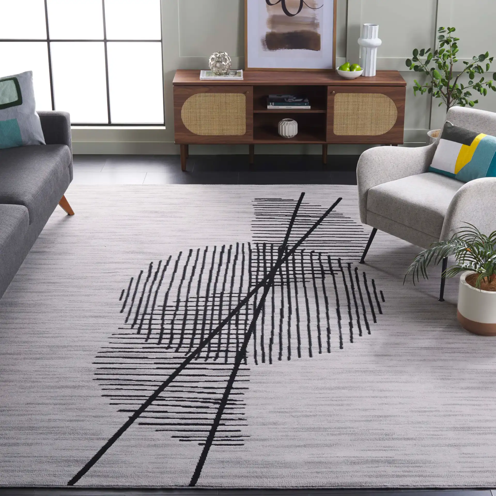 Odyssey Abstract Grid Rug in Gray / Gold in a styled room