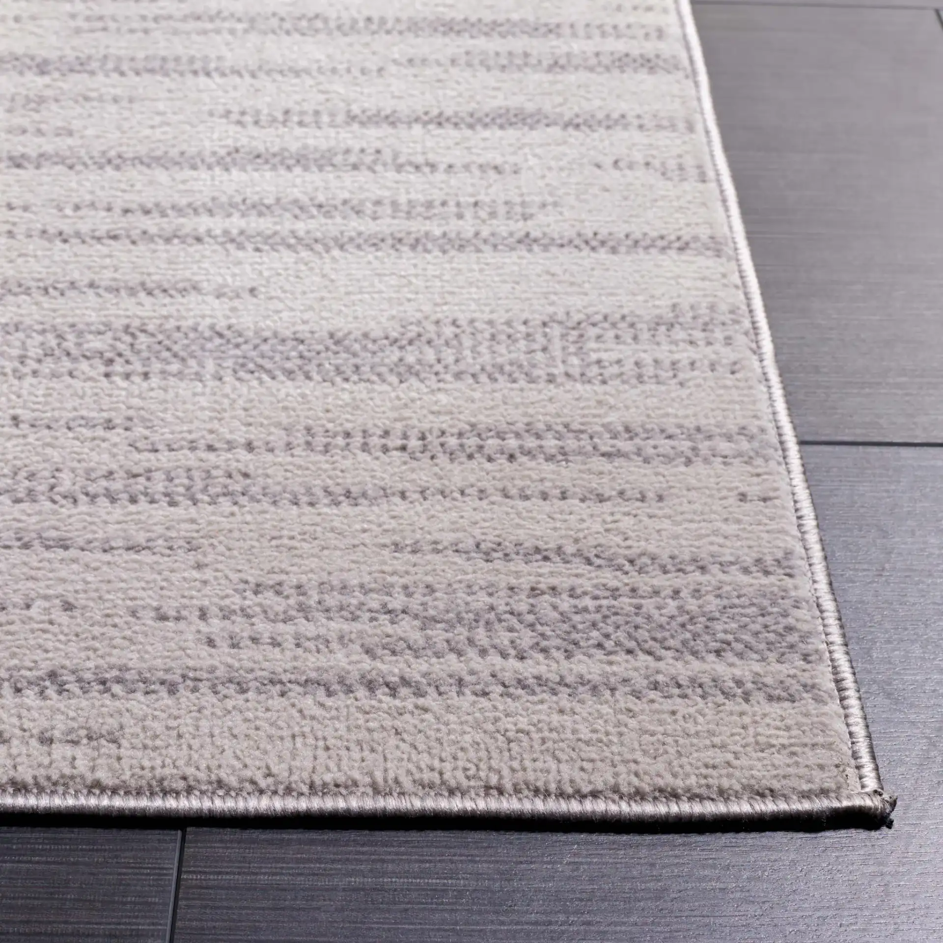 Odyssey Abstract Grid Rug in Gray / Gold in a styled room