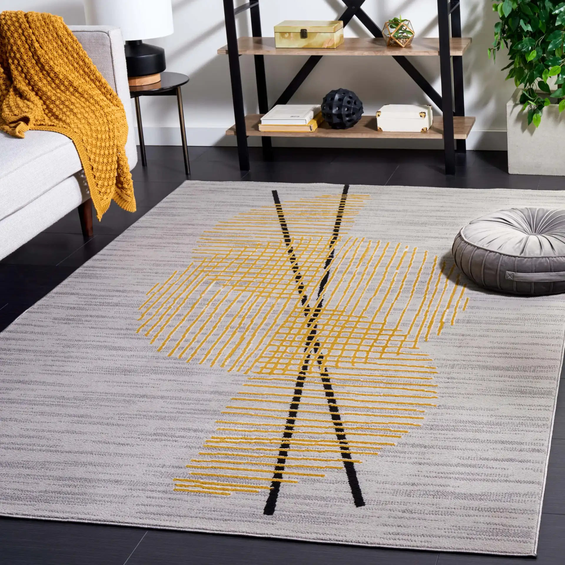Odyssey Abstract Grid Rug in Gray / Gold in a styled room