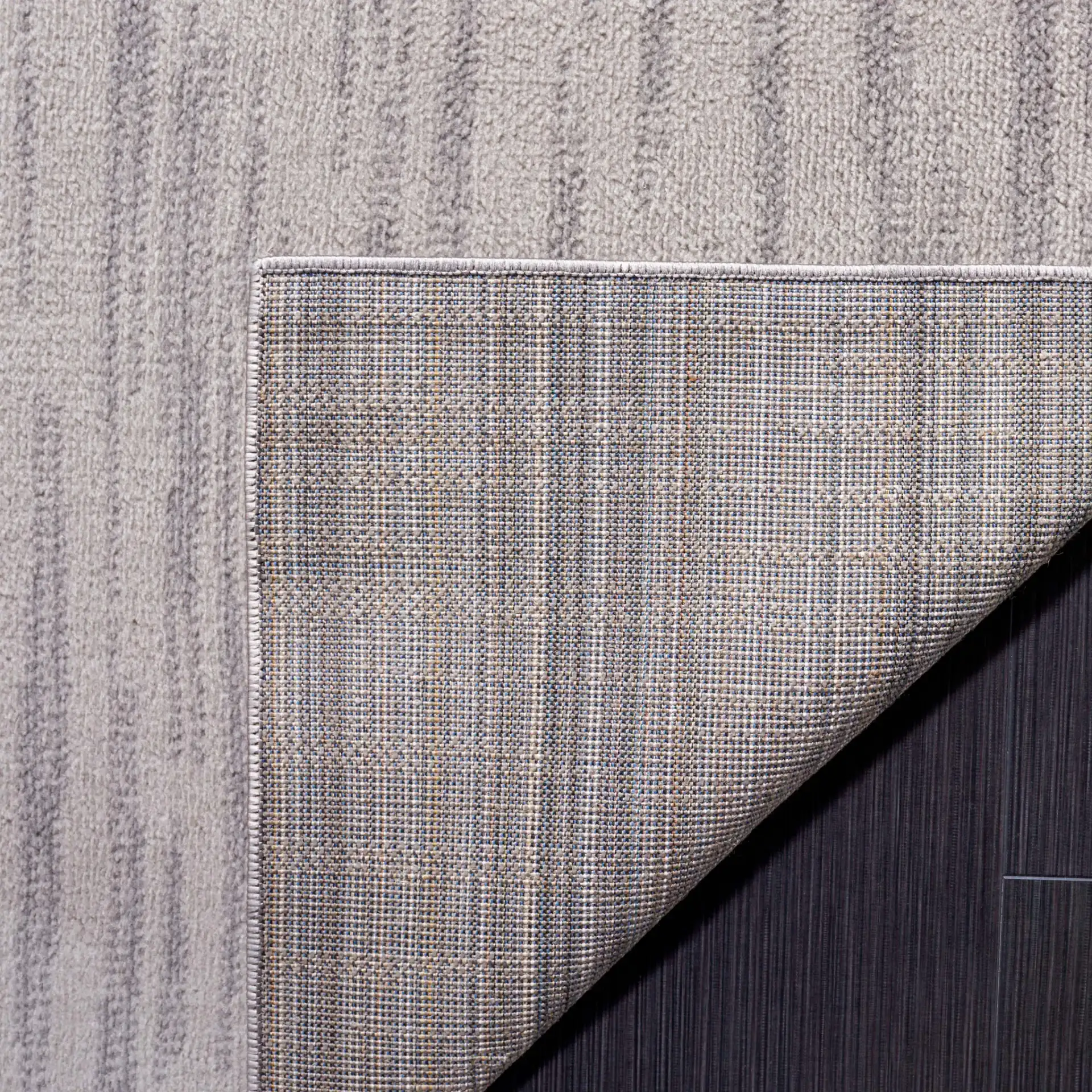 Odyssey Abstract Grid Rug in Gray / Gold in a styled room