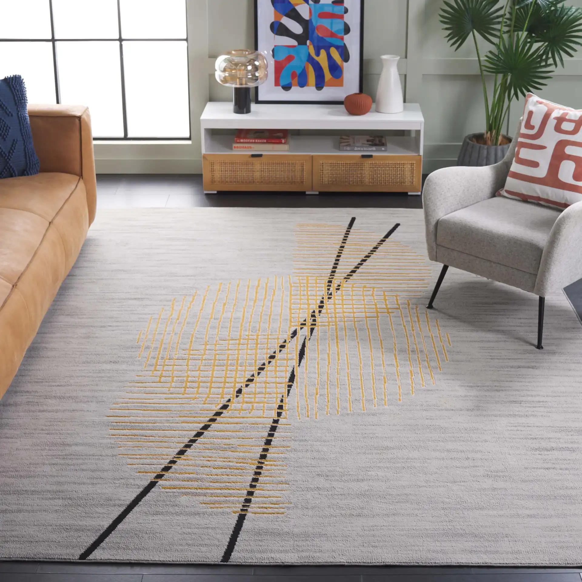 Odyssey Abstract Grid Rug in Gray / Gold in a styled room