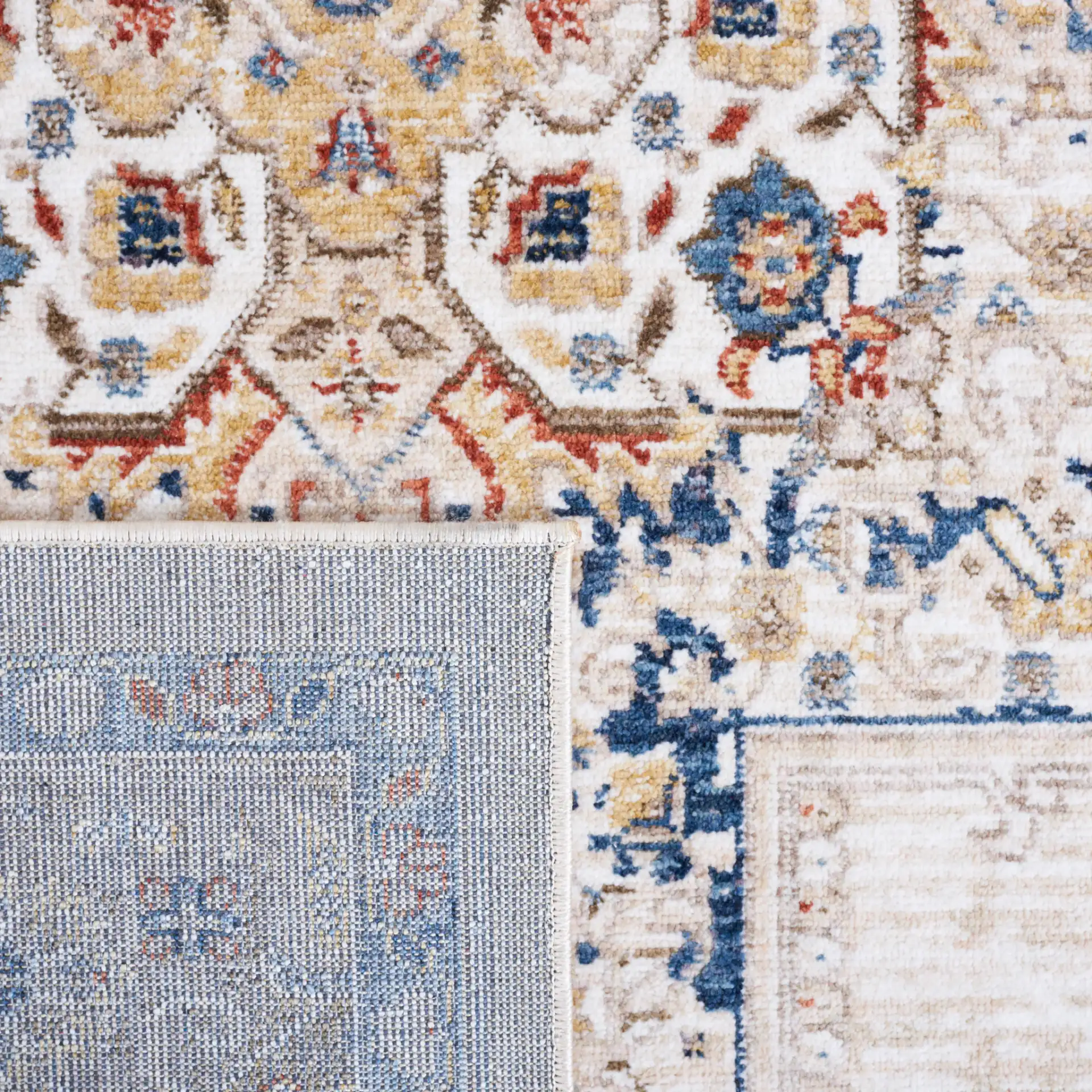Olympia Medallion Bordered Rug in Beige / Blue in a styled room