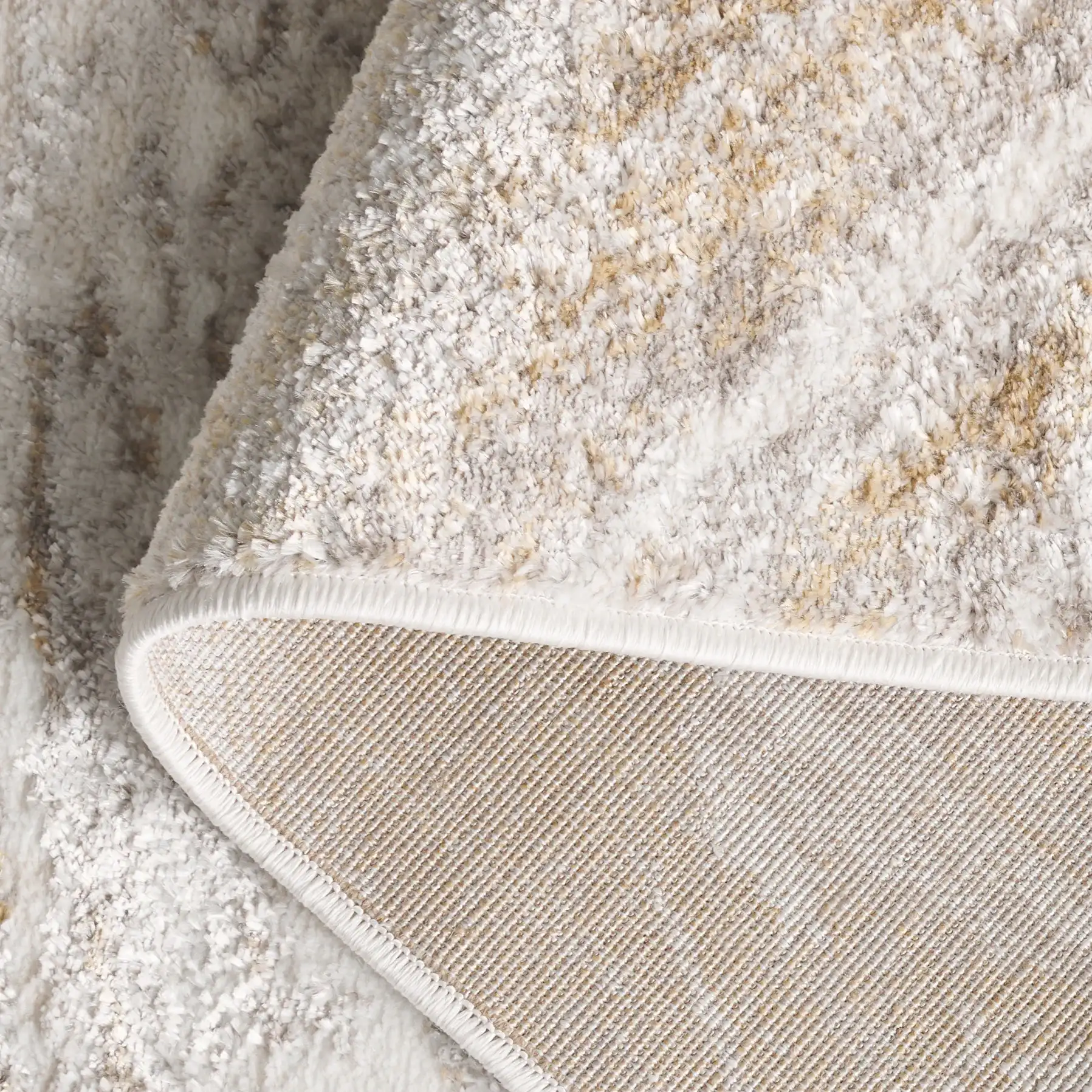 Orchard Marble Wave Rug in Gray / Gold in a styled room