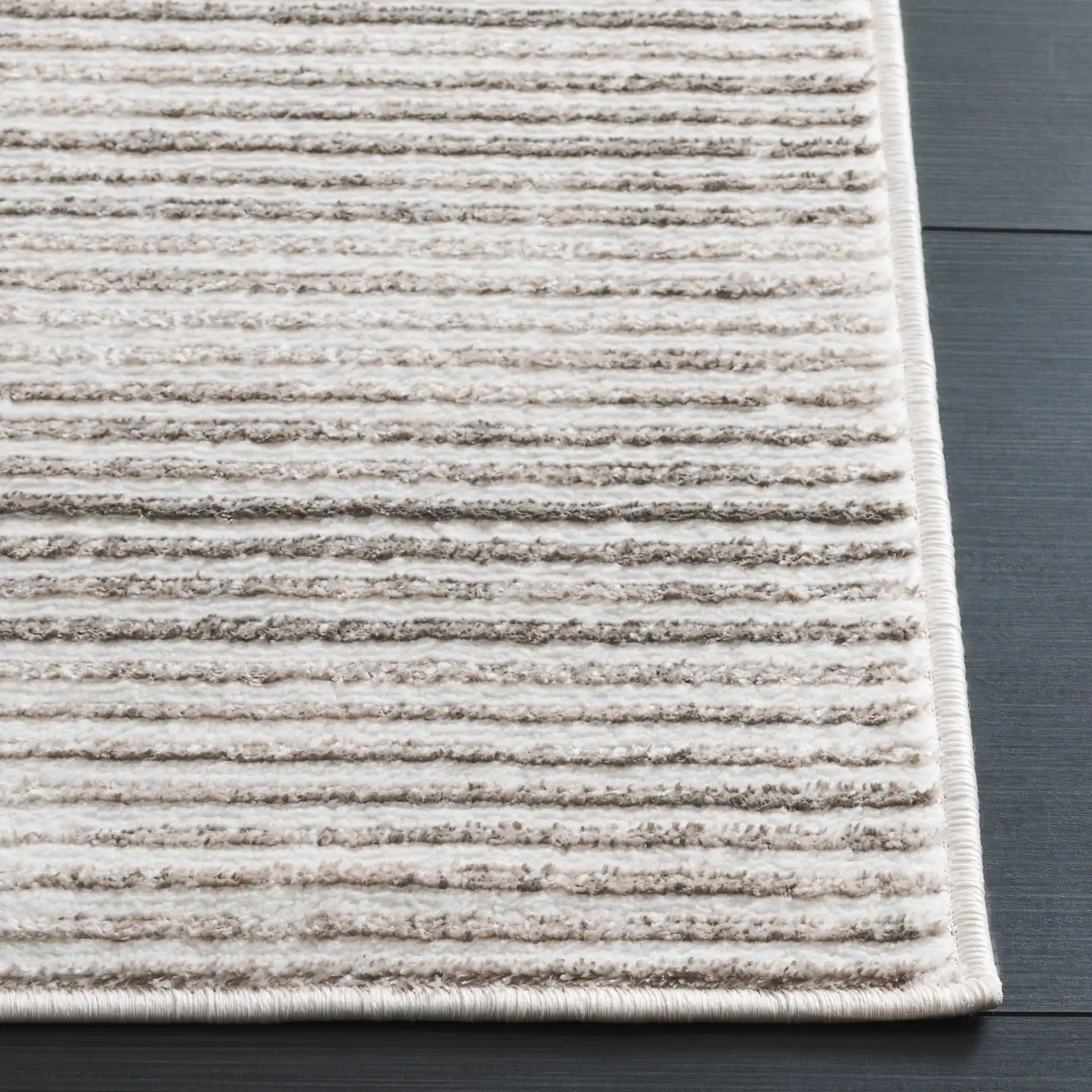 Orchard Ribbed Stripe Rug in Gray / Ivory in a styled room