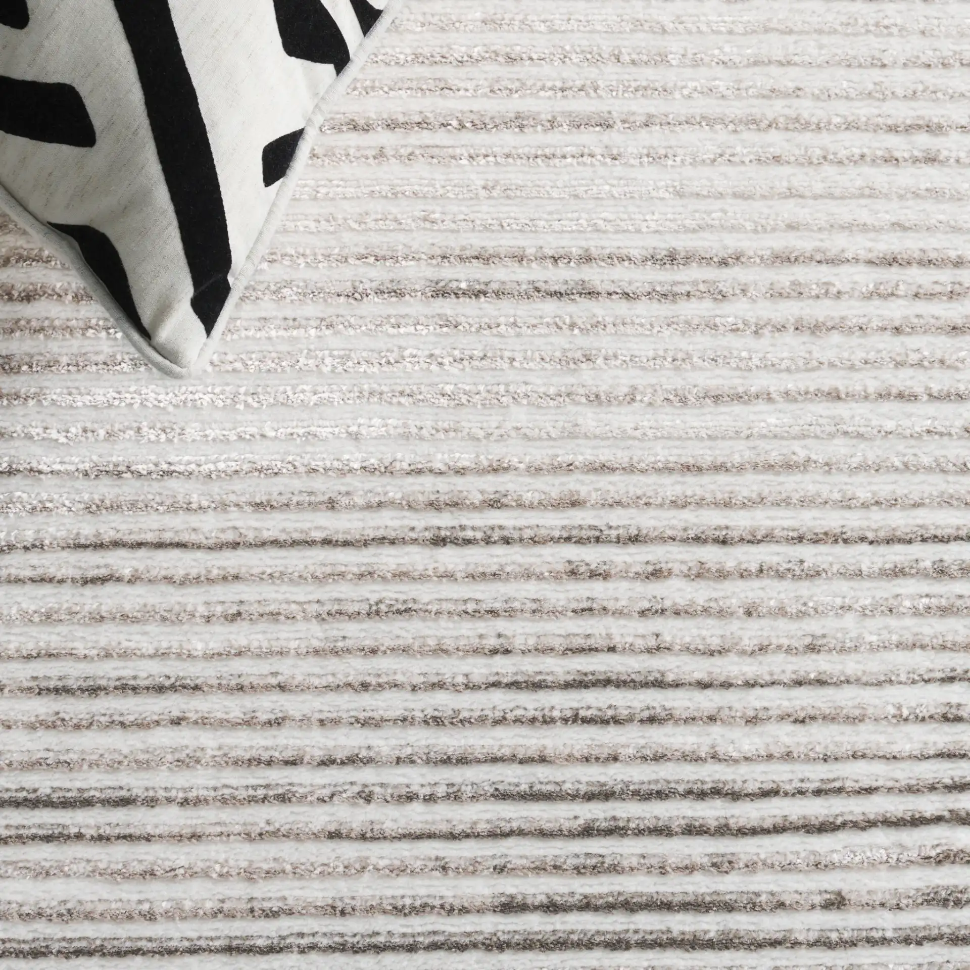 Orchard Ribbed Stripe Rug in Gray / Ivory in a styled room